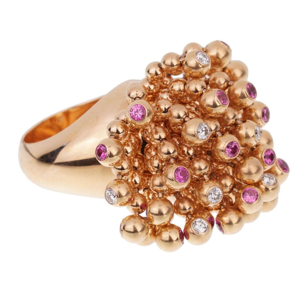 A fabulous cocktail ring by Cartier from the Paris Nouvelle Vague collection designed as bead tassels set with round brilliant cut diamonds and pink sapphires in 18k rose gold. The free flowing design of this iconic ring ensures brilliance from