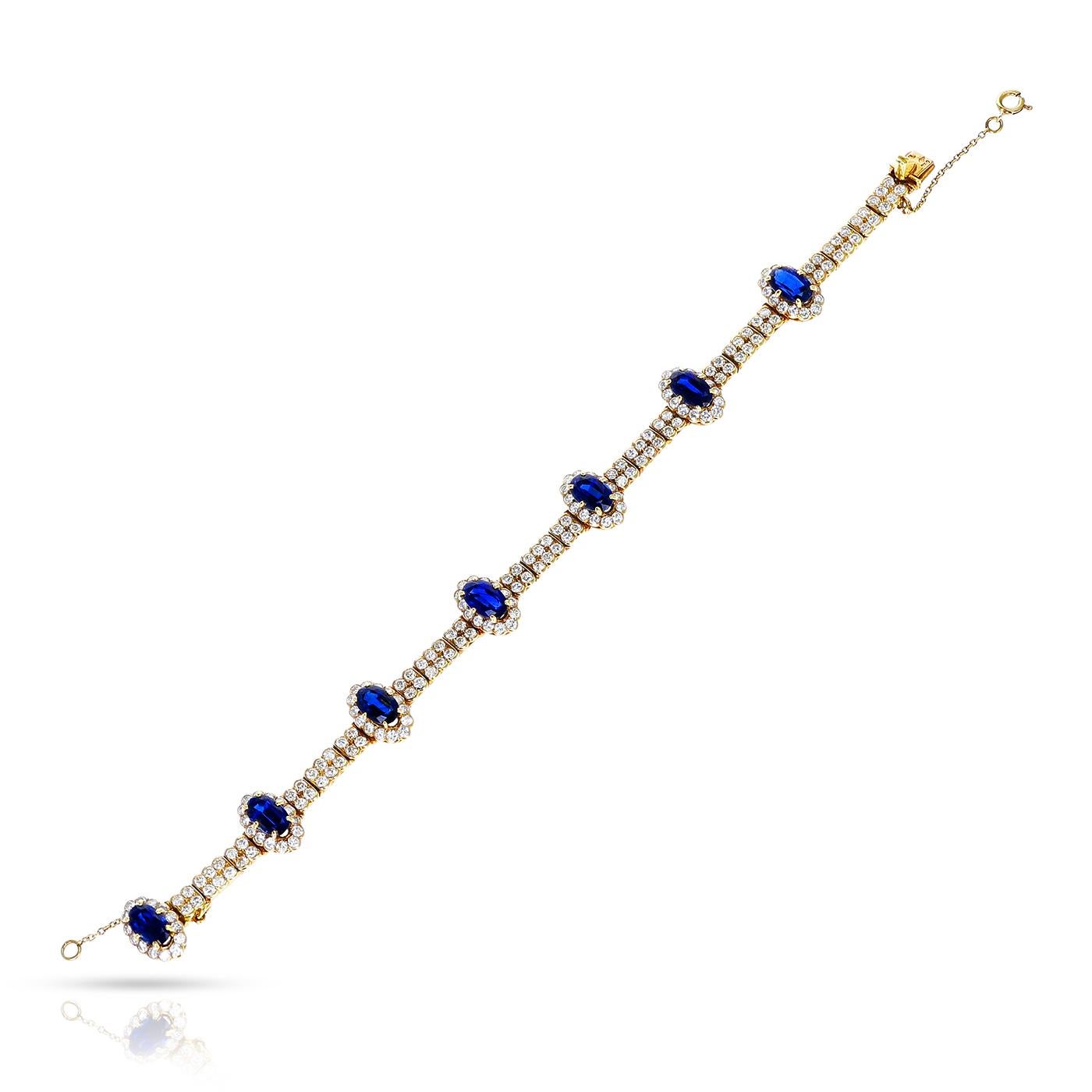 A Cartier Paris Oval Sapphire and Diamond Bracelet made in 18 Karat Gold. The total weight of the 7 sapphires is appx. 11 carats and the total diamond weight is appx. 11 carats. The total weight of the bracelet is 20 grams. The length is 7 inches. 

