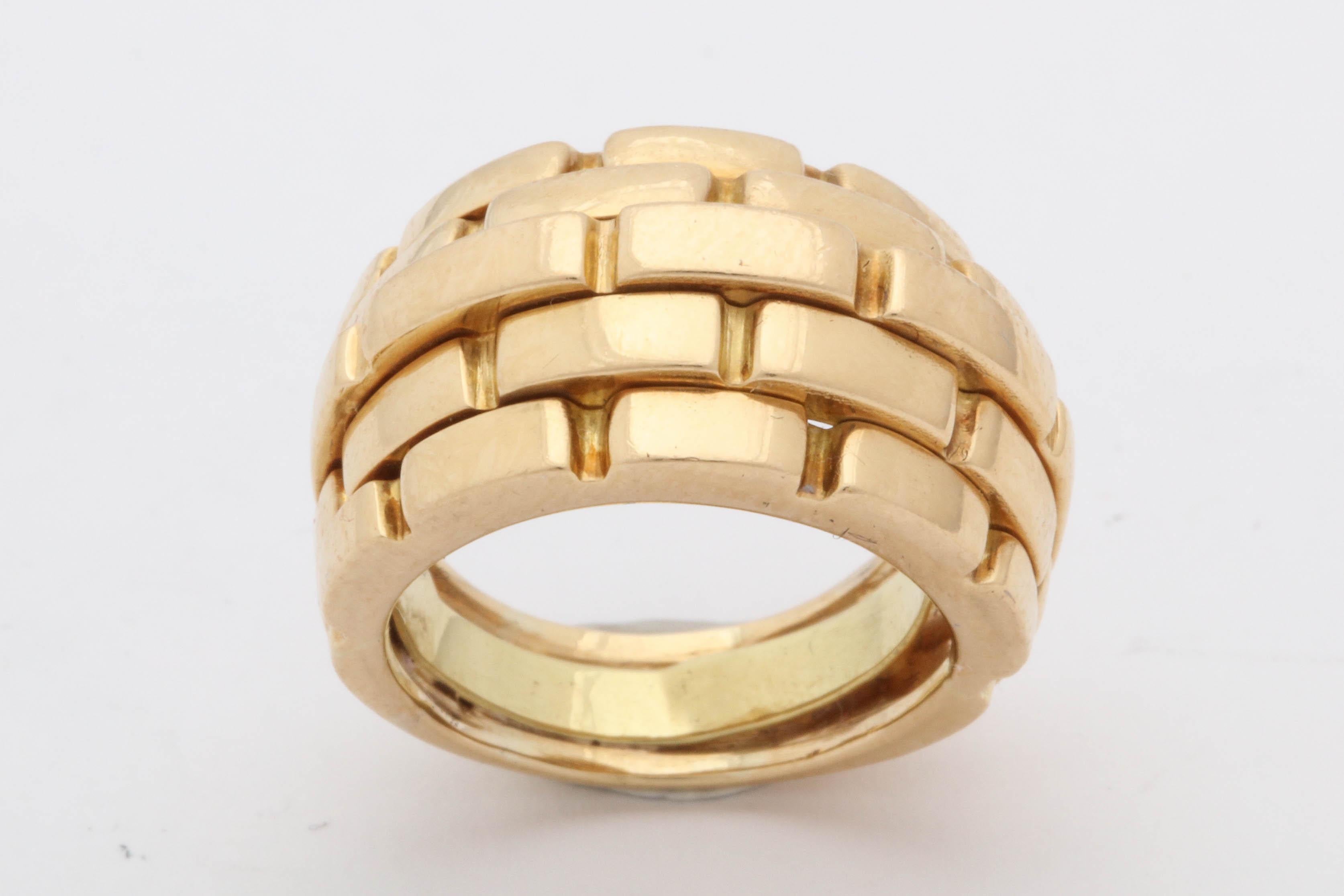 One Ladies 18kt Yellow Gold Panther Style Link Bombe Ring Size 5 . Created By Cartier In The 1980's In France. Serial# 6120. May Be Resized And Inside Guard May Be Taken Out.