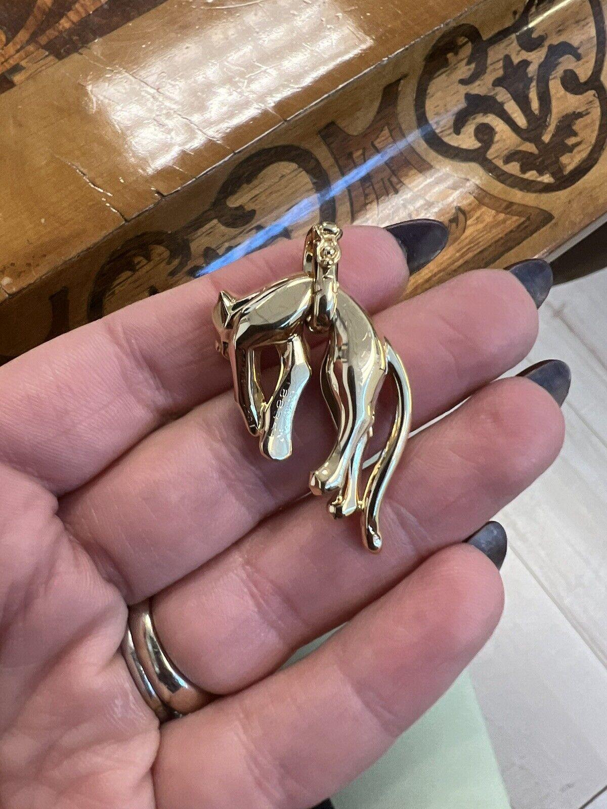 Cartier 18k Yellow Gold Panthere Collection Pendant w/Certificate Fully Hallmarked

Here is your chance to purchase a beautiful and highly collectible designer pendant.  

The weight is 18.5 grams.  This is fully hallmarked with serial #, French