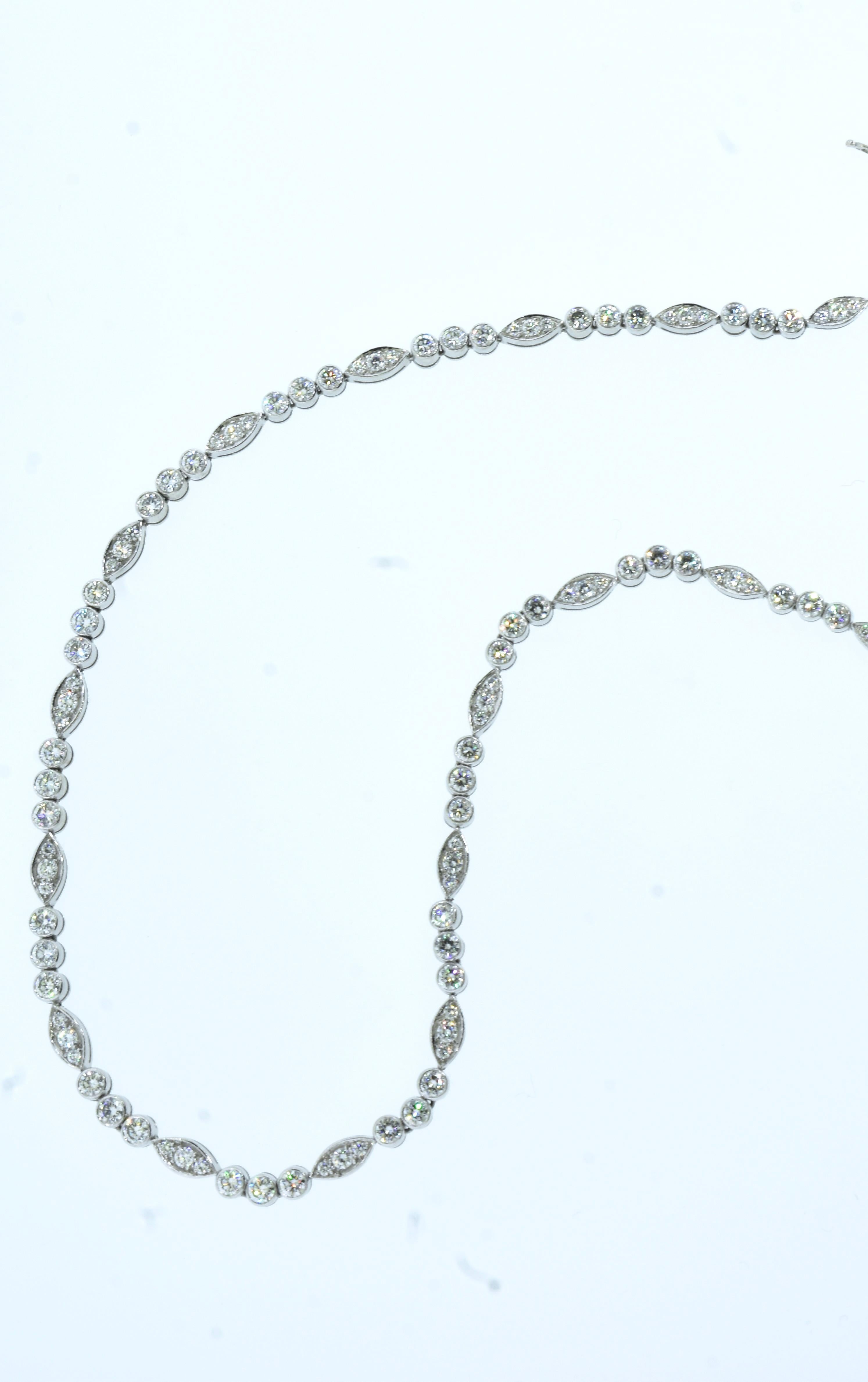 Cartier Paris platinum and diamond necklace.  The 120 well matched round brilliant cut diamonds are estimated to be colorless (E/F),  very very slightly included (VVS) and weigh totally 10 cts.  The clasp is invisible and well made with a safety