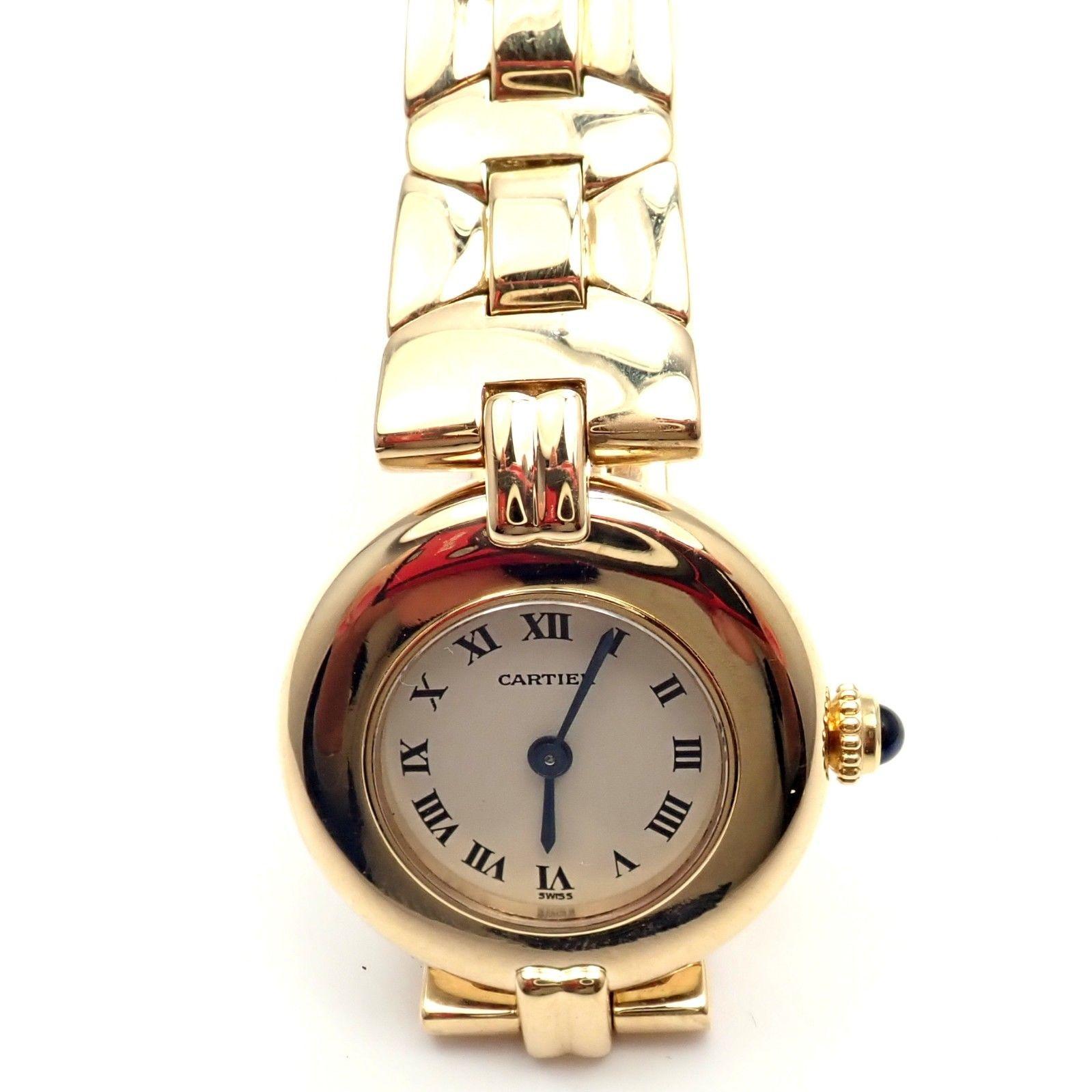 18k Yellow Gold Rivoli Lady's Wristwatch by Cartier with Quartz Movement. 
Great Working Condition
Rare Style 0297
Details: 
18k Yellow Gold Band + Case with folding clasp 
Case Dimensions: 23mm
Watch Length: 7