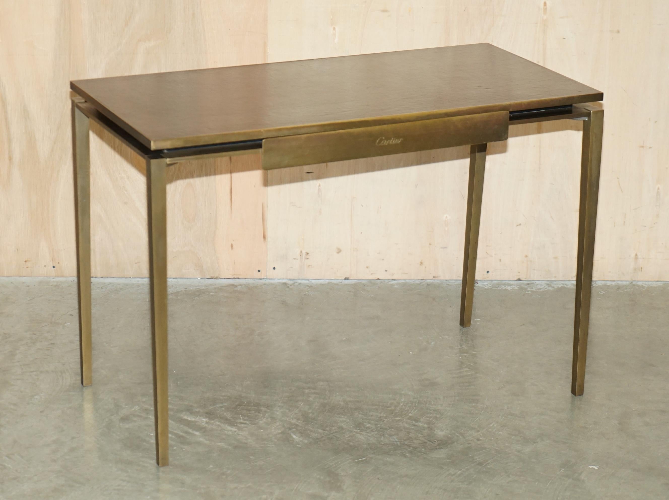 Royal House Antiques

Royal House Antiques is delighted to offer for sale one of two super rare, highly collectable, original Mid Century Modern Circa 1960-1970 Cartier Paris Bronze & Brown Leather Writing table Desks 

Please note the delivery fee