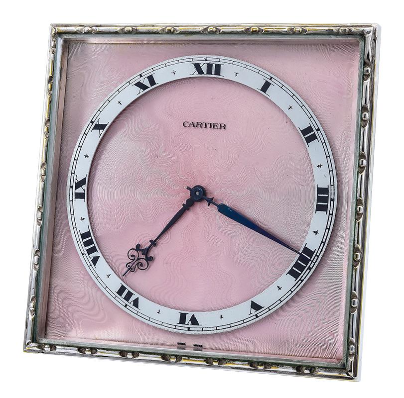 Outstanding Cartier sterling silver and enamel clock.  Made and signed by CARTIER PARIS.  Very heavy gauge sterling silver, with a brilliant pink guilloche enamel face.  Mechanical.  4