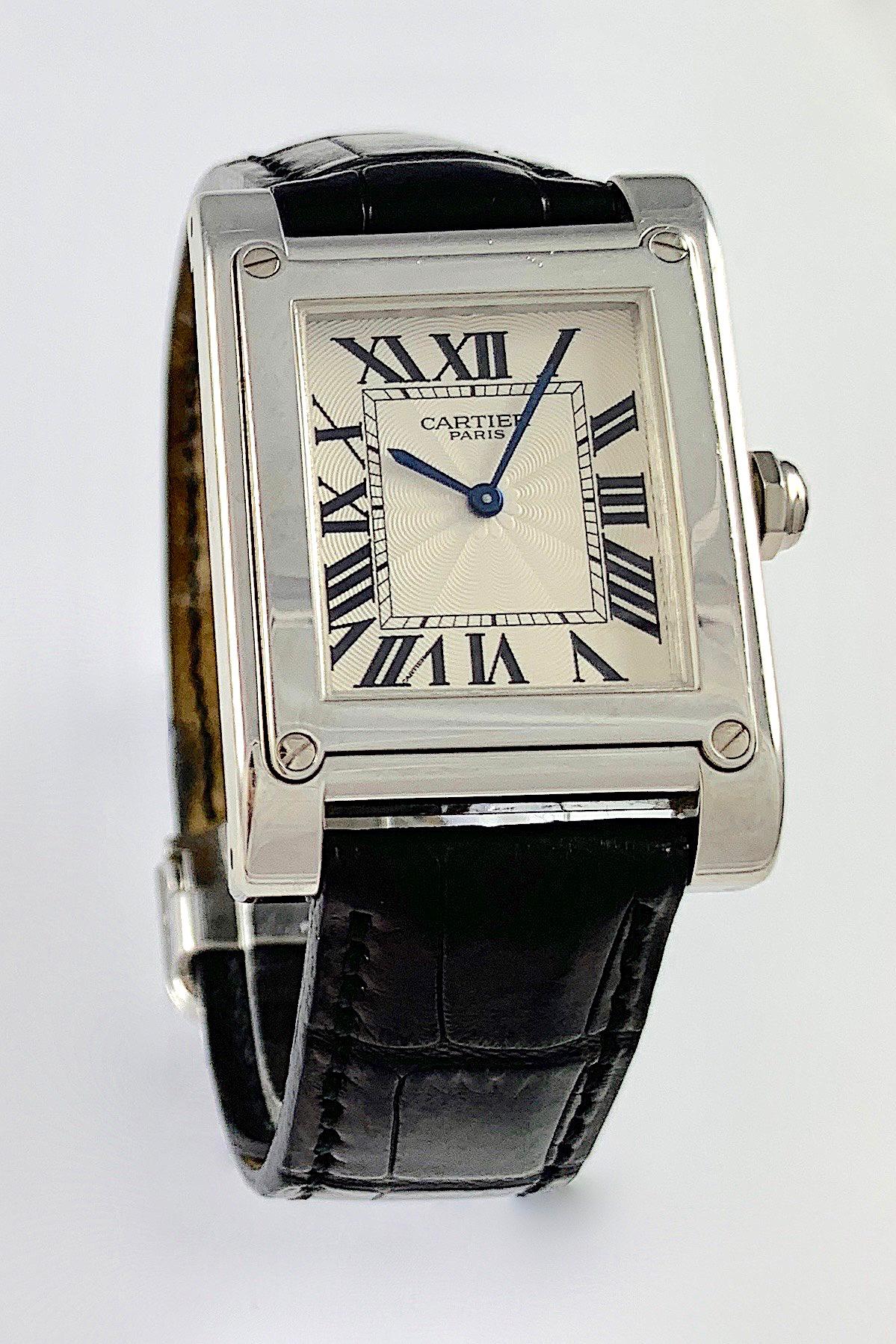 Cartier Paris Platinum Tank A Vis Prive Mecanique Manual Wind Watch
Classic Cartier Tank Design
Platinum Case
Manual Wind/ Mecanique Movement
Cartier Paris Hand Decorated Guilloche Dial
Classic Blue Cartier Hands
Signed and Engraved