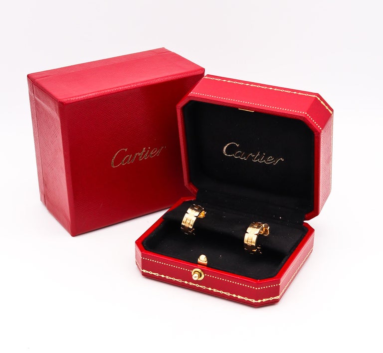 Tank Francaise hoop earrings designed by Cartier.

A extremely popular contemporary design, created in Paris France by the iconic jewelry house of Cartier. These very chic classic pair of earrings, has been carefully crafted with the  Tank Francaise