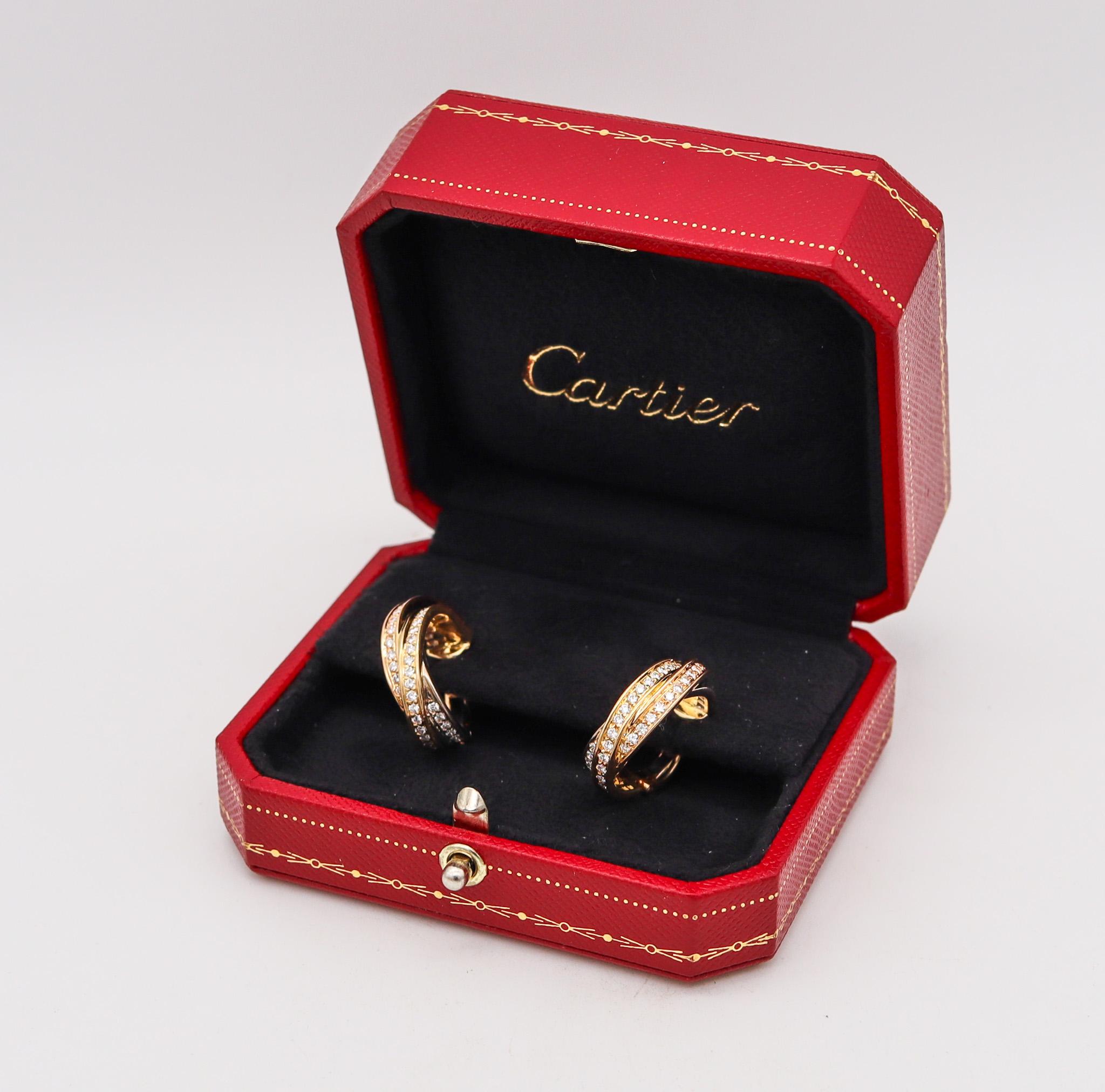 Trinity hoops earrings designed by Cartier.

Beautiful everyday pair of earrings, created in Paris France by the jewelry house of Cartier. These iconic hoop earrings has been crafted in three colors of 18 karats, with high polished finish. They are
