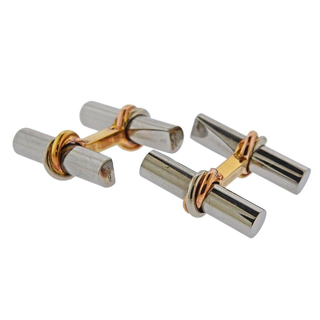 Pair of 18k gold and steel Trinity cufflinks by Cartier Paris. Cufflink measurs 22mm x 8mm. Weight is 9.6 grams. Marked Cartier, Acier, 750, 674673, French marks.