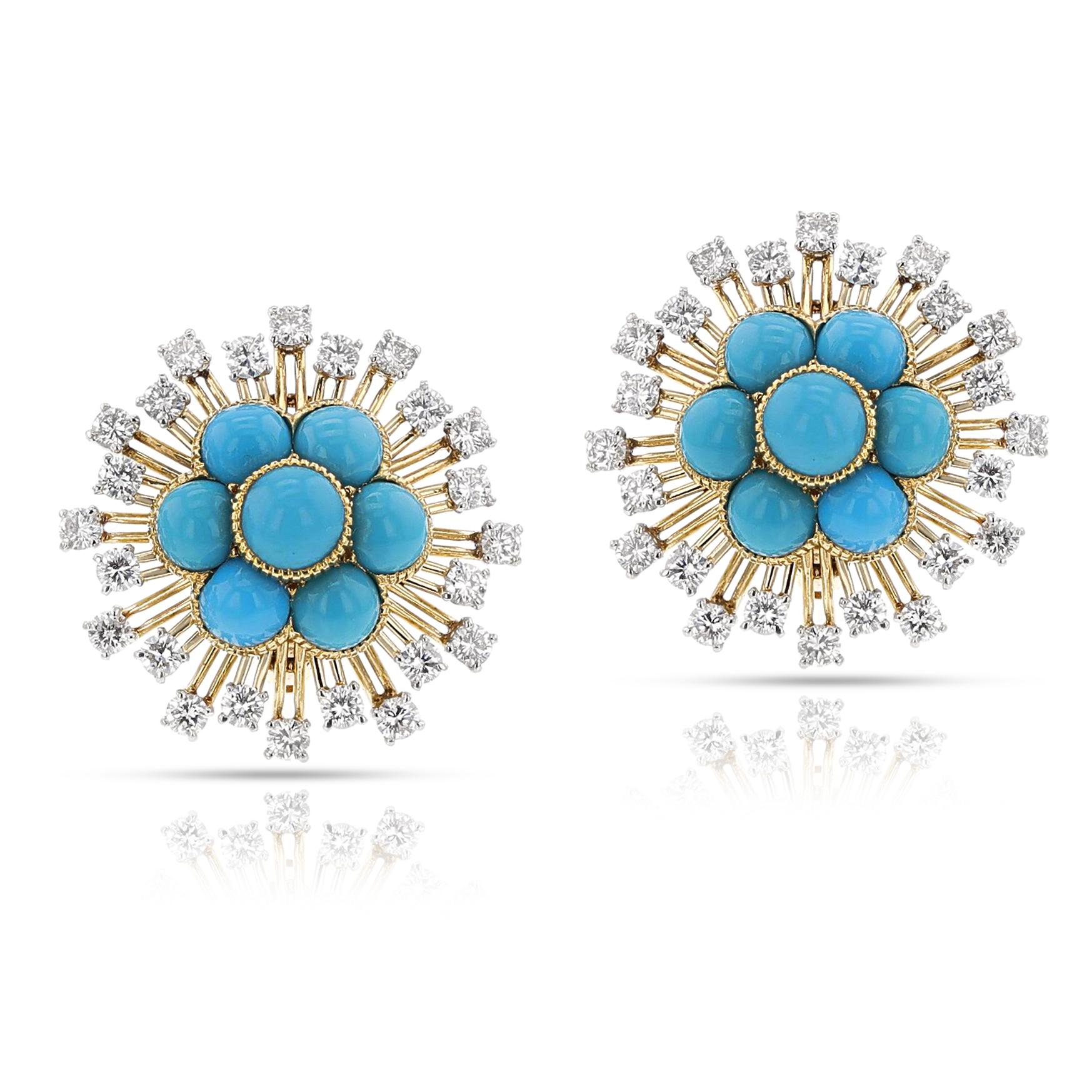 A pair of Cartier Paris Turquoise Cabochon Floral Earrings made in 18k yellow gold and Platinum. The turquoise cabochons are surrounded by rays set with diamonds.
Signed Cartier Paris France, maker's mark. The total weight of the earring is 18.02
