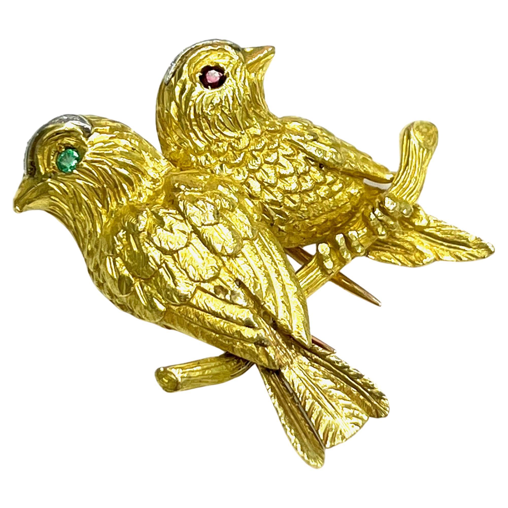 Cartier Paris Two Birds Yellow Gold Brooch, French

Two birds on a branch, round-cut emerald and round-cut ruby, set on 18 karat yellow gold; marked Paris

Size: width 3.5 cm; length 3.5 cm
Total weight: 16.0 grams