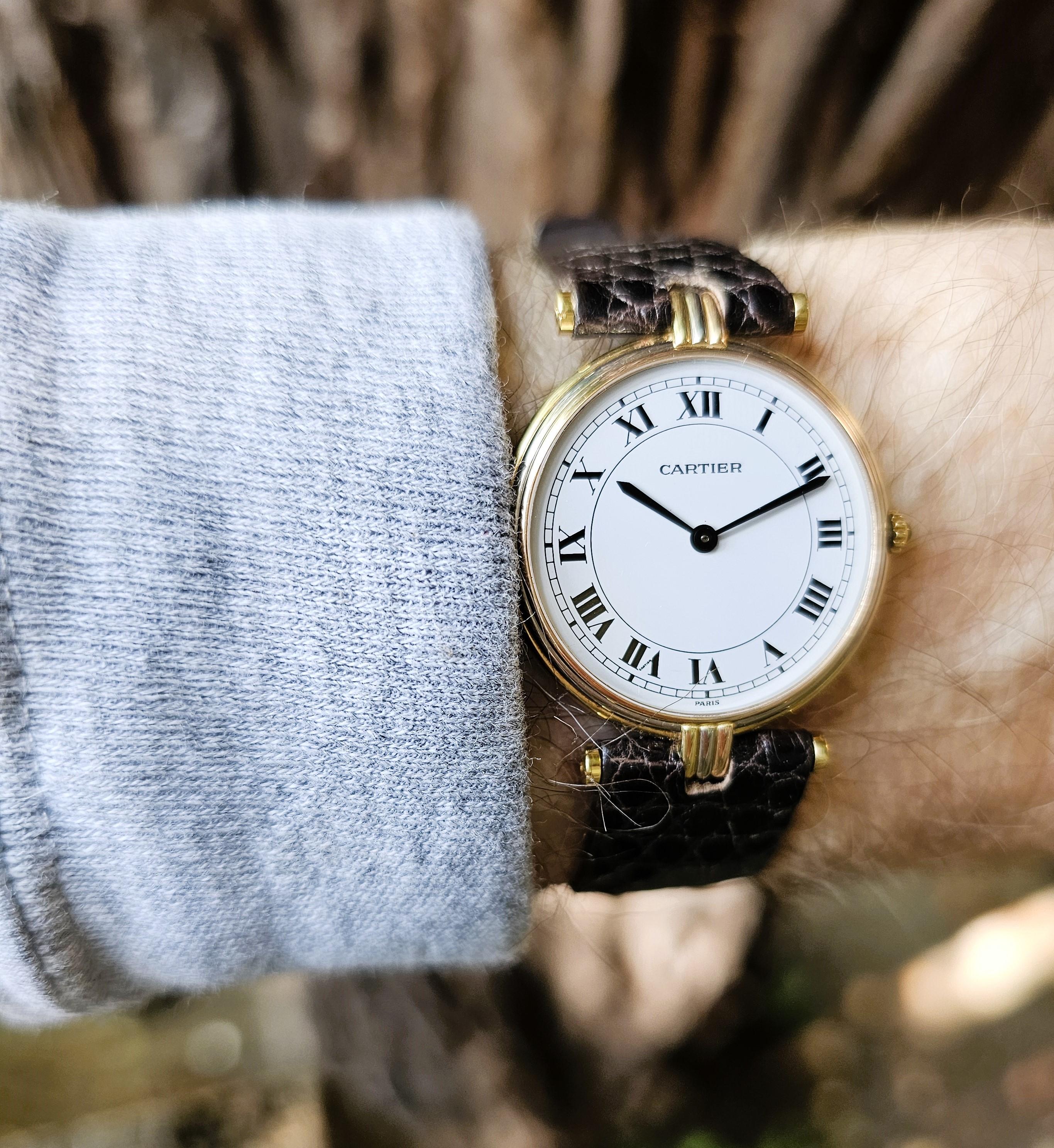 Introduction:   
Cartier Vendome LC Trinity GM large size watch.  The watch is made in 3-18 Karat gold colors; white,yellow, and rose.  The watch measures 30mm in diameter, x  36mm high.  The watch has a White Roman numeral dial, with stirrups lugs.