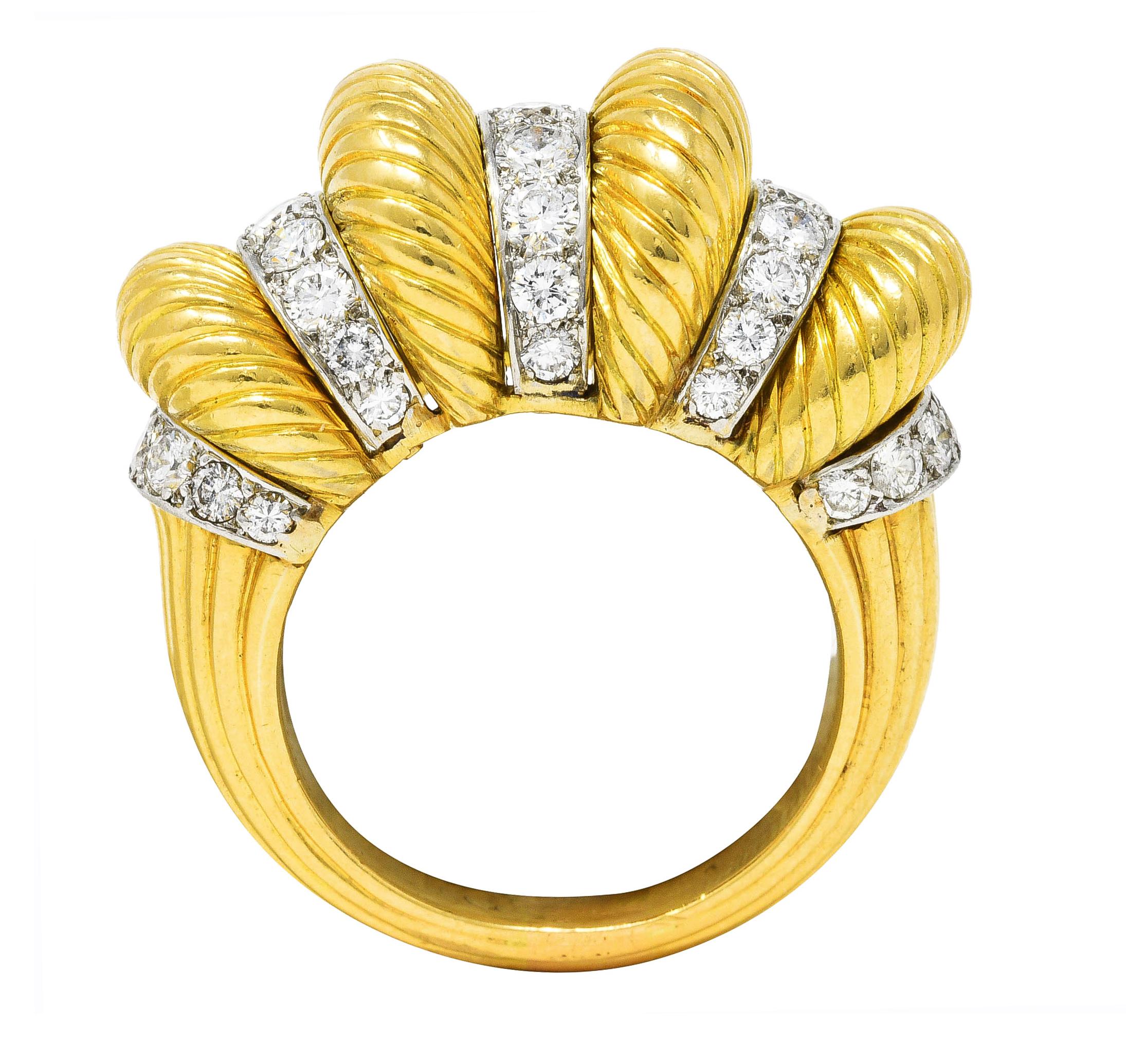 Cocktail ring is designed as puffed gold segments with ridged textured throughout

Alternating with white gold recesses pavè set with round brilliant cut diamonds

Weighing approximately 1.50 carats total - G/H in color with VS clarity

Completed by
