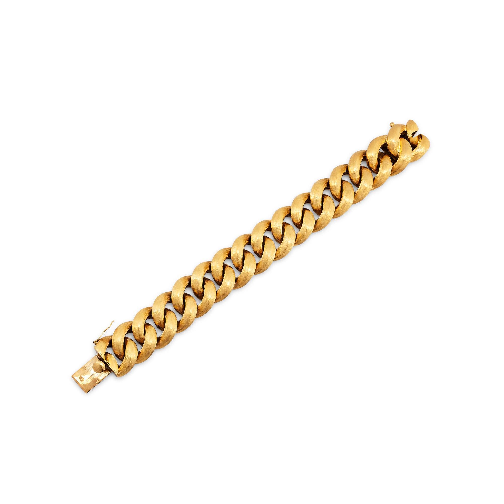 Puffed up with lots of chunky style, this vintage Cartier curb link bracelet is a powerful statement.  With a elegant brushed finish, this three-dimensional 18 karat yellow gold link bracelet is both collectible and the perfect 24/7 wardrobe