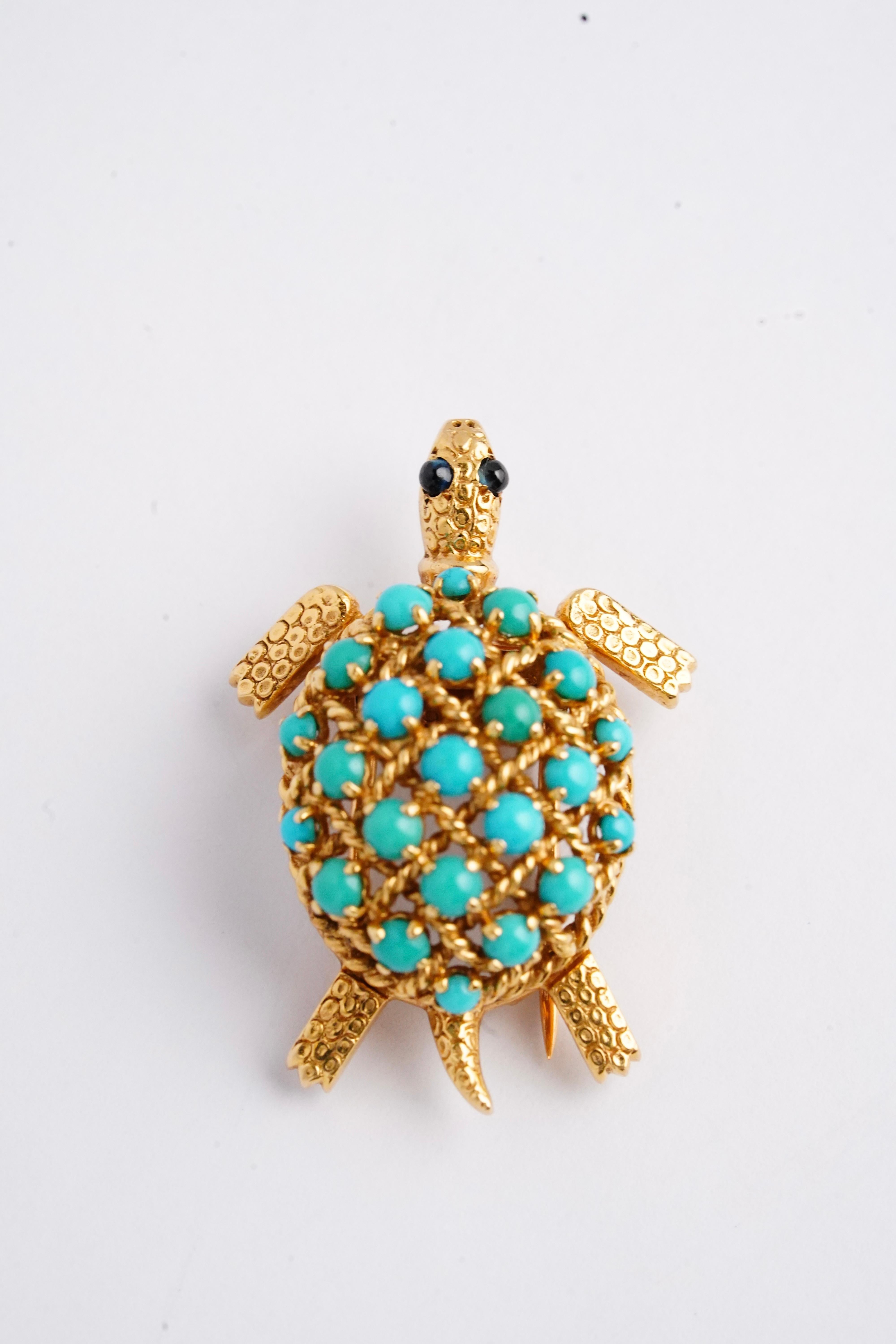 The adorable vintage lapel clip/brooch is such a fun and unique piece! It features a sweet little turtle, with its head and flippers peeking out of its shell, made up in 18K yellow gold and a variety of different types of stone. This piece was