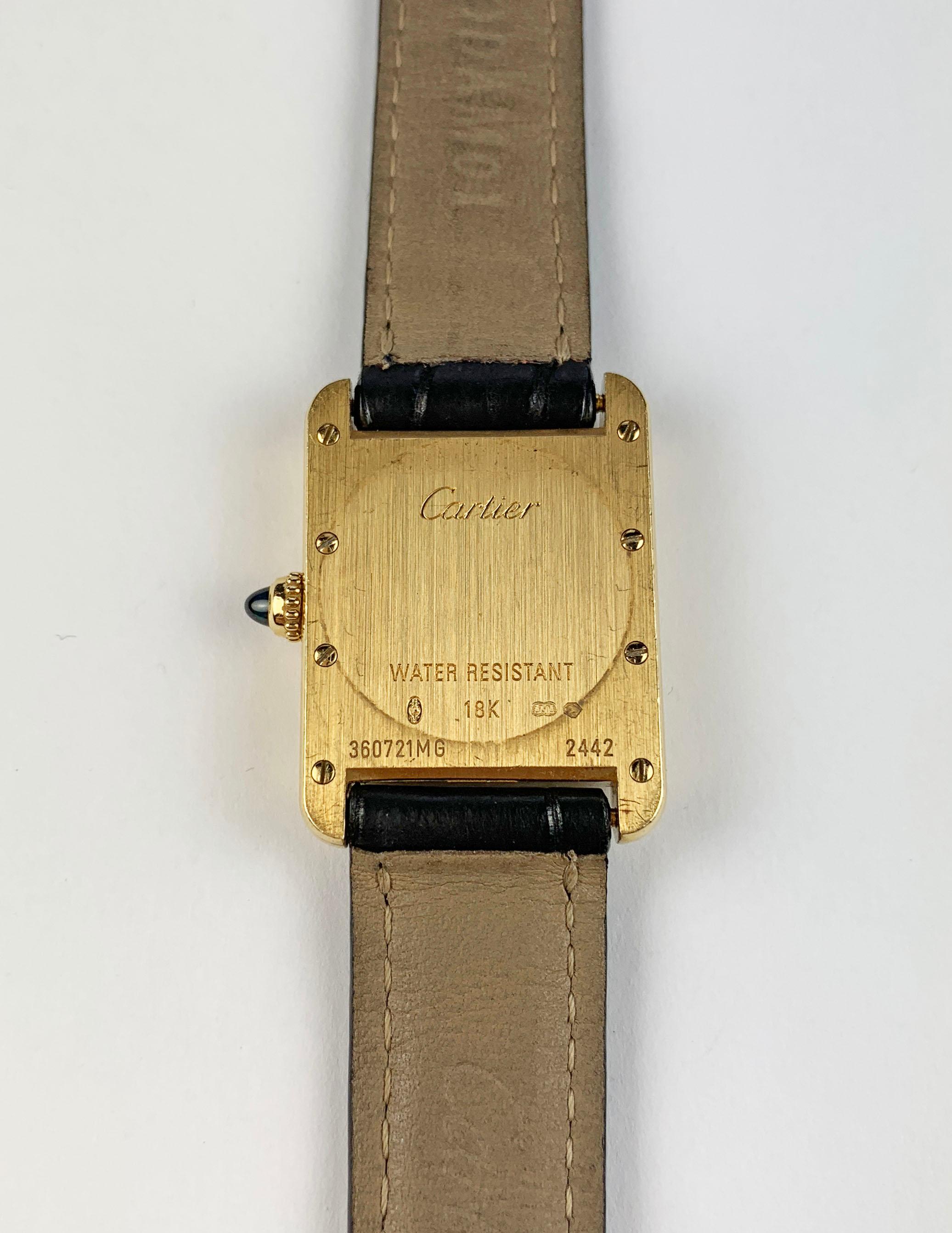 Cartier Paris Yellow Gold Gold Tank Ladies Watch
Cartier Classic Roman Numeral Dial
Signed and Engraved Case-Back
Signed Cartier Leather Strap
29mm x 22mm
Original Signed Cartier 18K Rose Gold Buckle with Hallmarks
One Year Warranty on Movement and