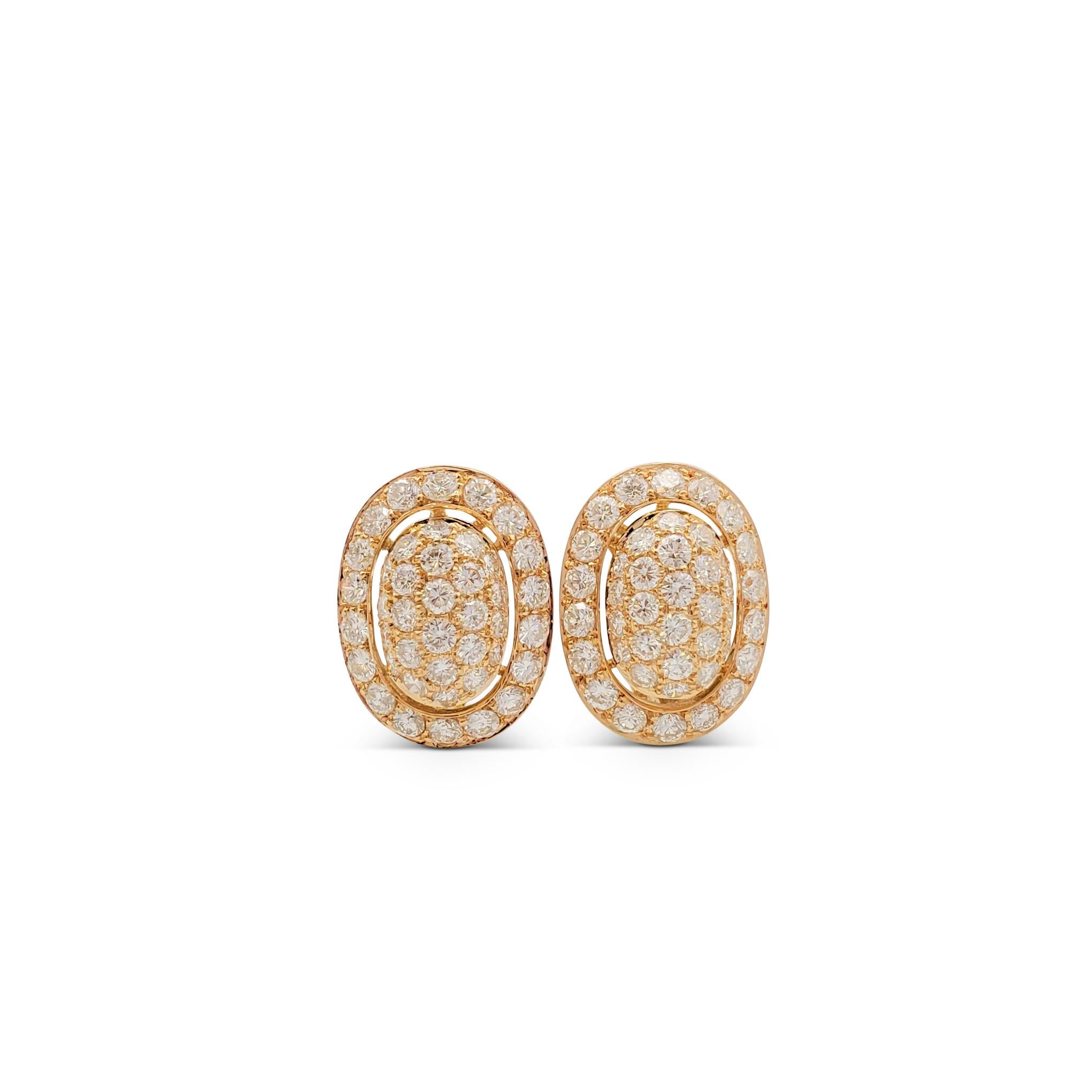 Authentic elegant Cartier Paris clip-on earrings crafted in 18 karat yellow gold with an estimated 3.00 carats of sparkling pavé set round brilliant cut diamonds (E-F, VS). Signed Cartier Paris, 750, with serial number and hallmarks. The earrings