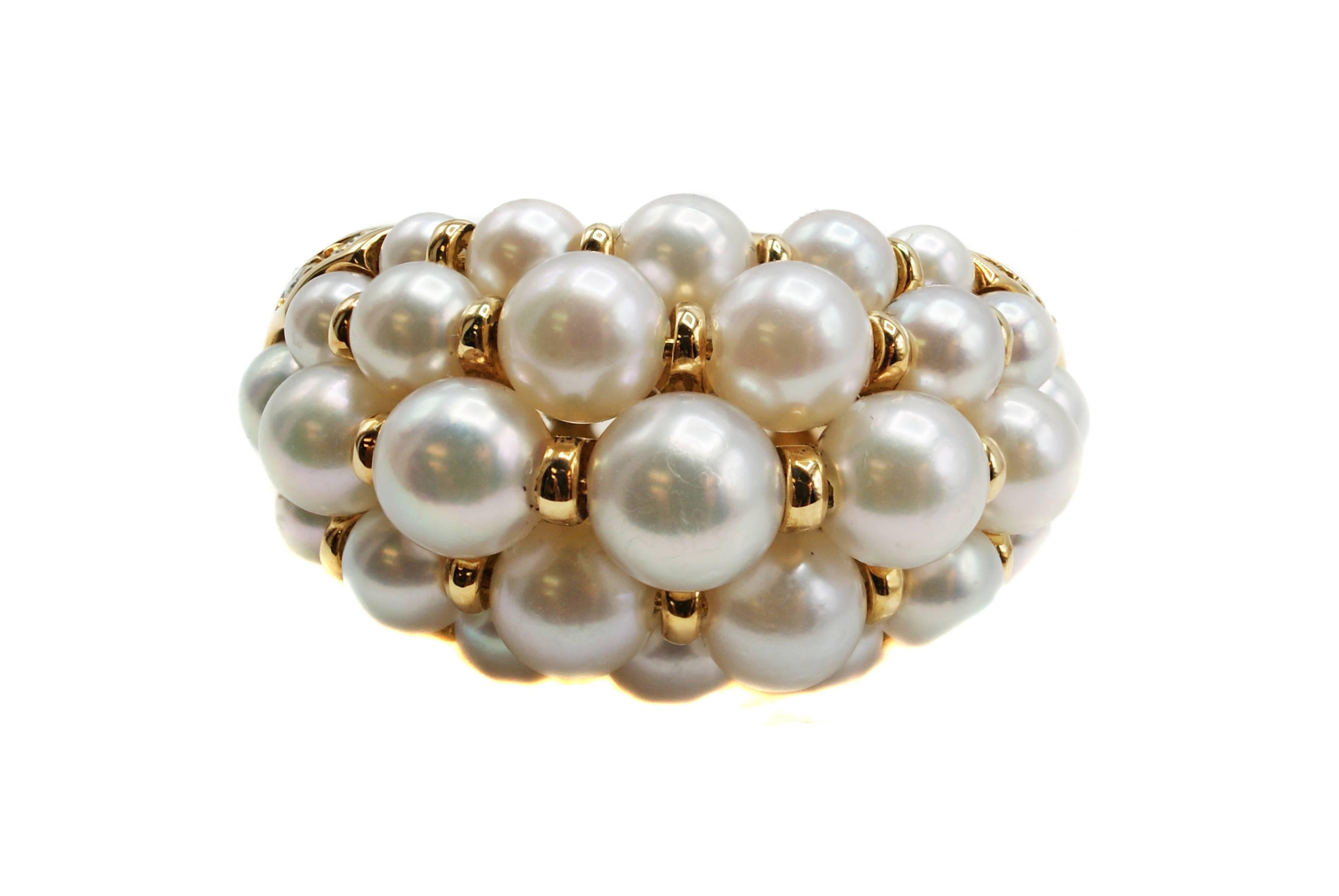 This charming ring by Cartier Paris was manufactured in the 90s predominantly for the European market. The Andromaque ring is wonderfully handcrafted in 18 karat yellow gold and perfectly set with 31 white bright and lustrous Akoya pearl separated