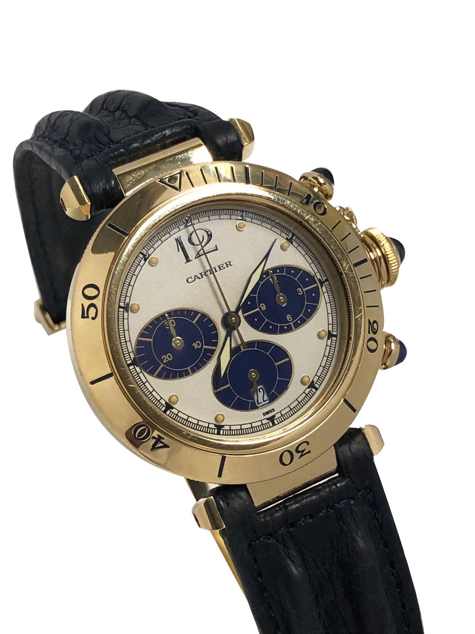 Circa 2000 Cartier, Pasha De Cartier Wrist watch, 38 M.M. 18K yellow Gold 3 piece water resistant case, quartz movement, Chronograph timing functions , water resistant lock down Sapphire crown and Sapphire Chronograph Crowns. White dial with Blue