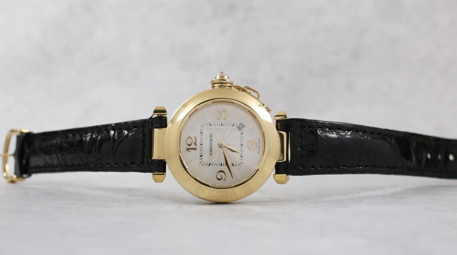 As one of Cartier’s most iconic models, this excellent timepiece is a must have. Made from only the best materials, sporting a round case crafted in solid 18k yellow gold in addition to the leather strap and gold tang buckle. A small cap and chain