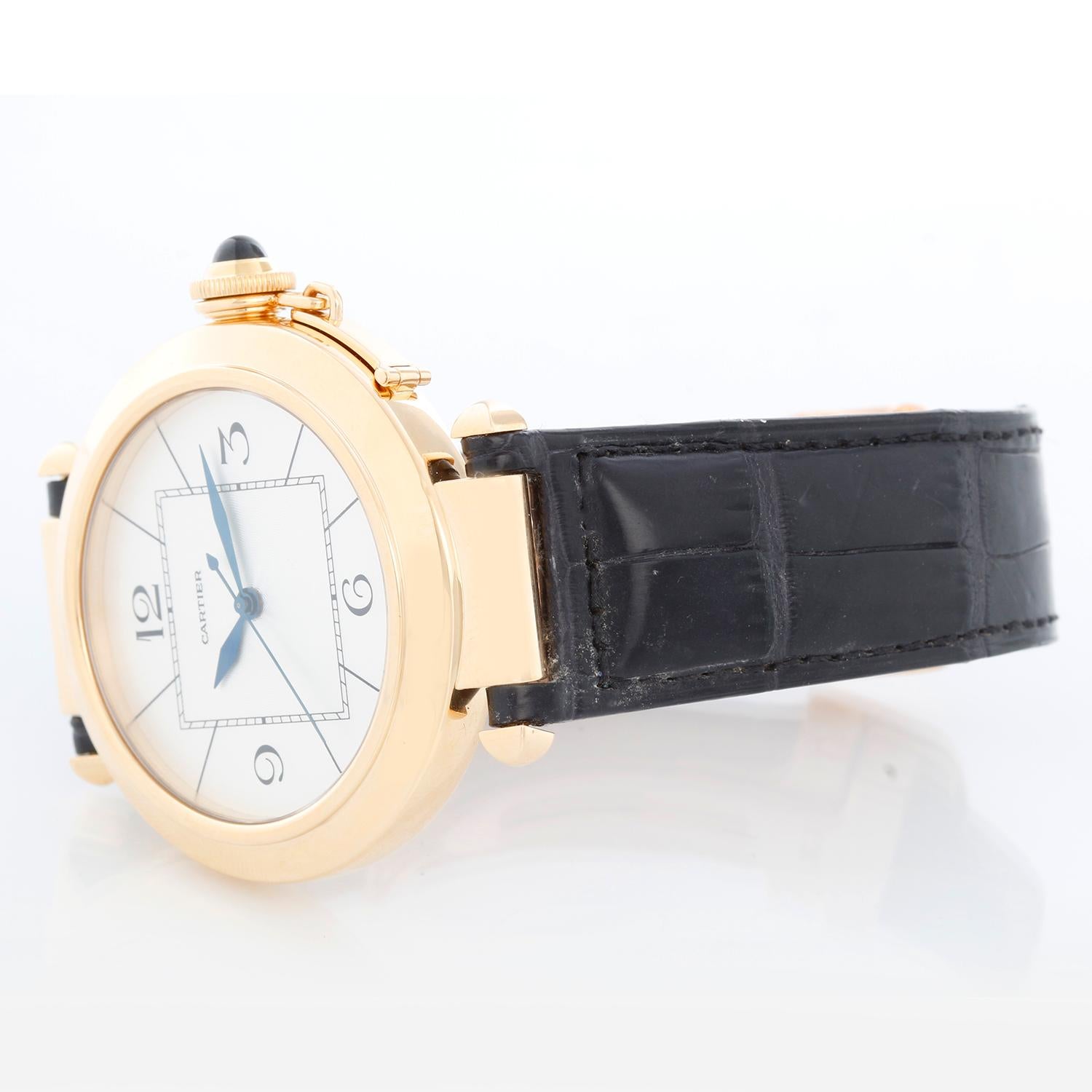 Cartier Pasha 18k Yellow Gold 42 MM Automatic Watch 2726 - Automatic. 18k yellow gold case with sapphire crown (42 mm diameter). Silver guilloche dial with blue hands. Croc strap with 18k yellow gold Cartier deployant buckle. Pre-owned with Cartier