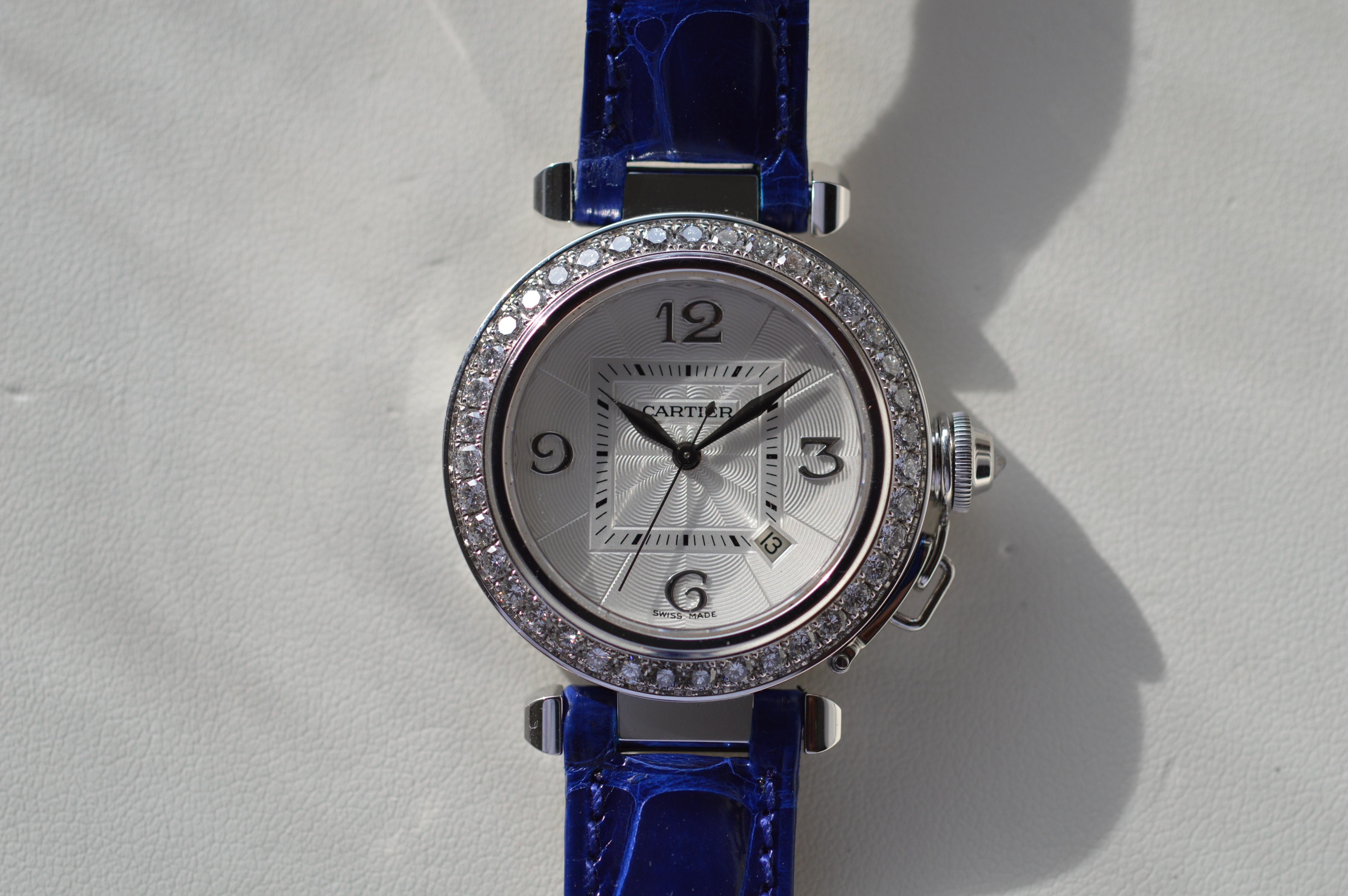 Cartier Pasha 32mm 18K White Gold on Leather Strap with Diamond Bezel and Crown
Reference n° WJ111631
32mm Size
18K White Gold Case
Blue Leather Strap
Diamond Crown
Guilloché Dial
Water-Resistant
Automatic Movement
Open Back Case
Diamond Bezel
40