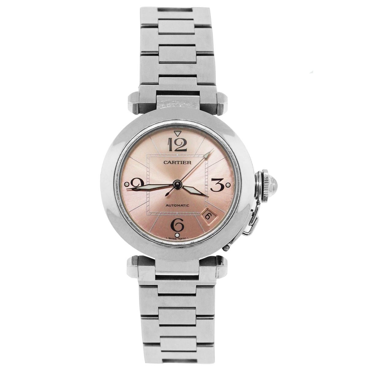 Brand: Cartier
MPN: 2324
Model: Pasha
Case Material: Stainless Steel
Crystal: Sapphire crystal
Bezel: Stainless Steel smooth fixed bezel
Dial: Pink dial with Black  luminescent hour markers and hands. Date is displayed in between 4 and 5 o'