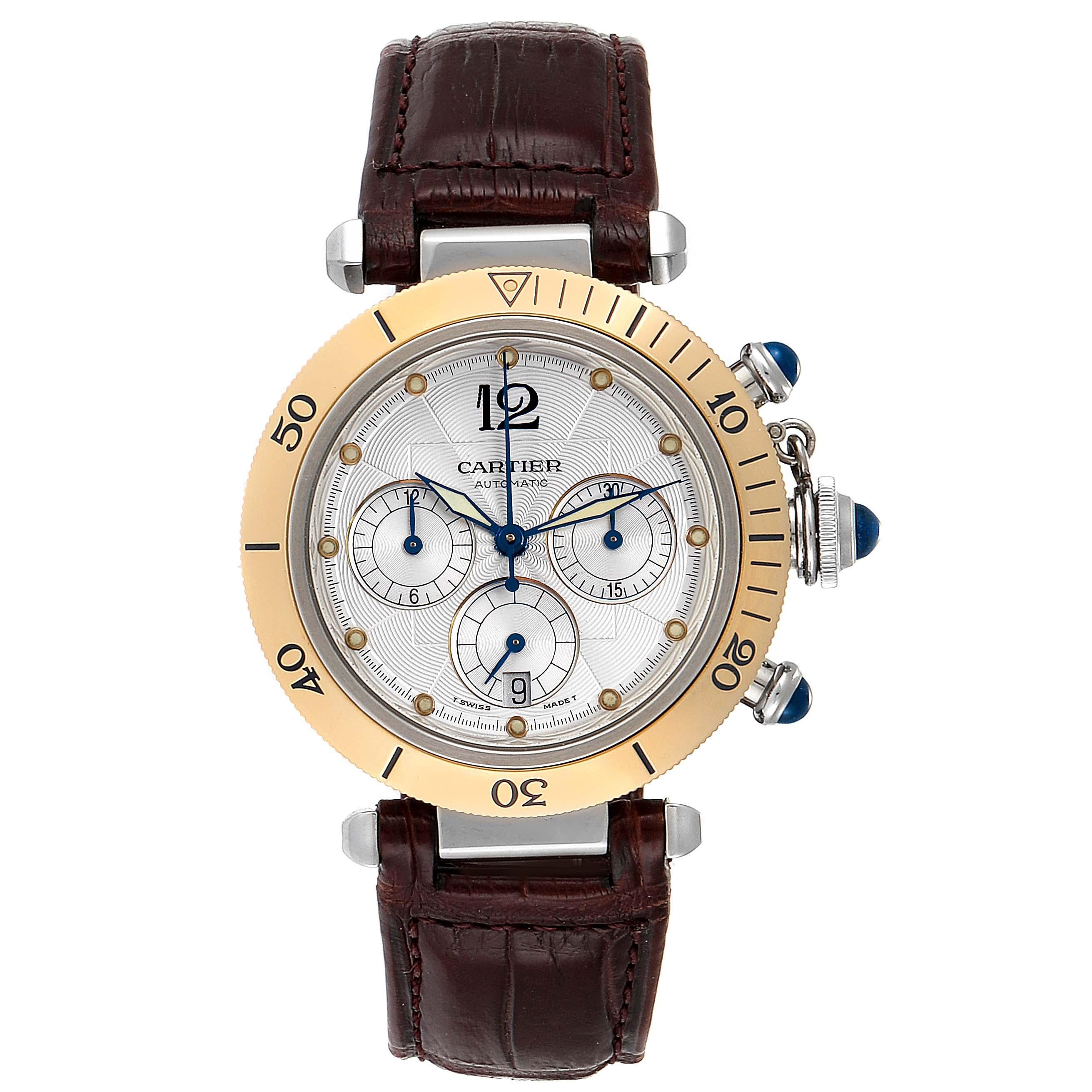 Cartier Pasha 38mm Chronograph Steel Yellow Gold Mens Watch W3014051. Automatic self-winding chronograph movement. Caliber 049. Round stainless steel case 38.0 mm in diameter. Crown cover with blue spinel. Transparent exhibition case back. 18K