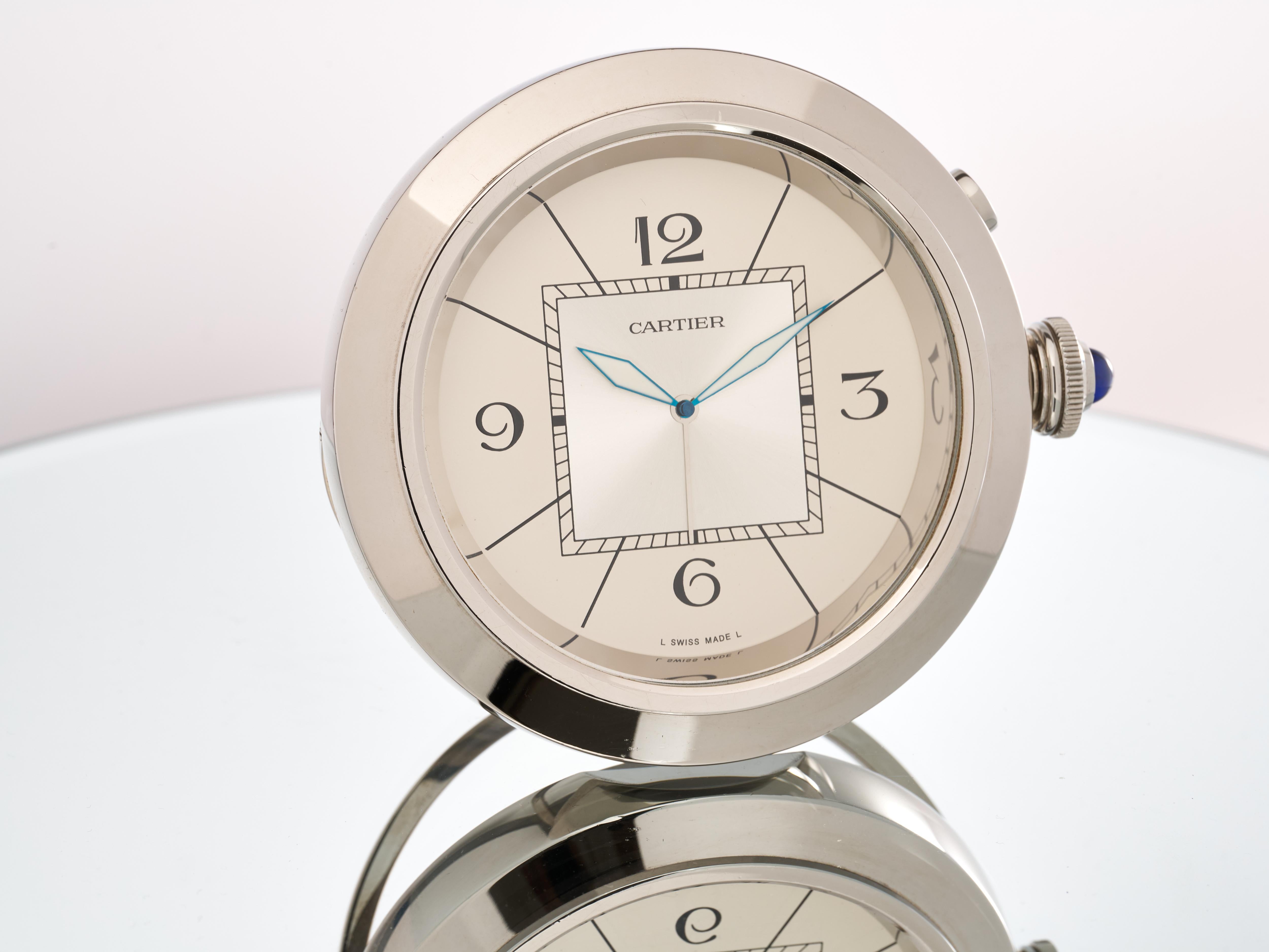 Fork In Time is proud to offer on the 1st Dibs marketplace:

Cartier 
Pasha
Alarm Clock 
For Desk or Mantle

Silver Dial with Arabic Numeral Indices 
Polished Stainless Steel Front and sides with Brushed Steel reverse

Quartz Movement
 

Ref