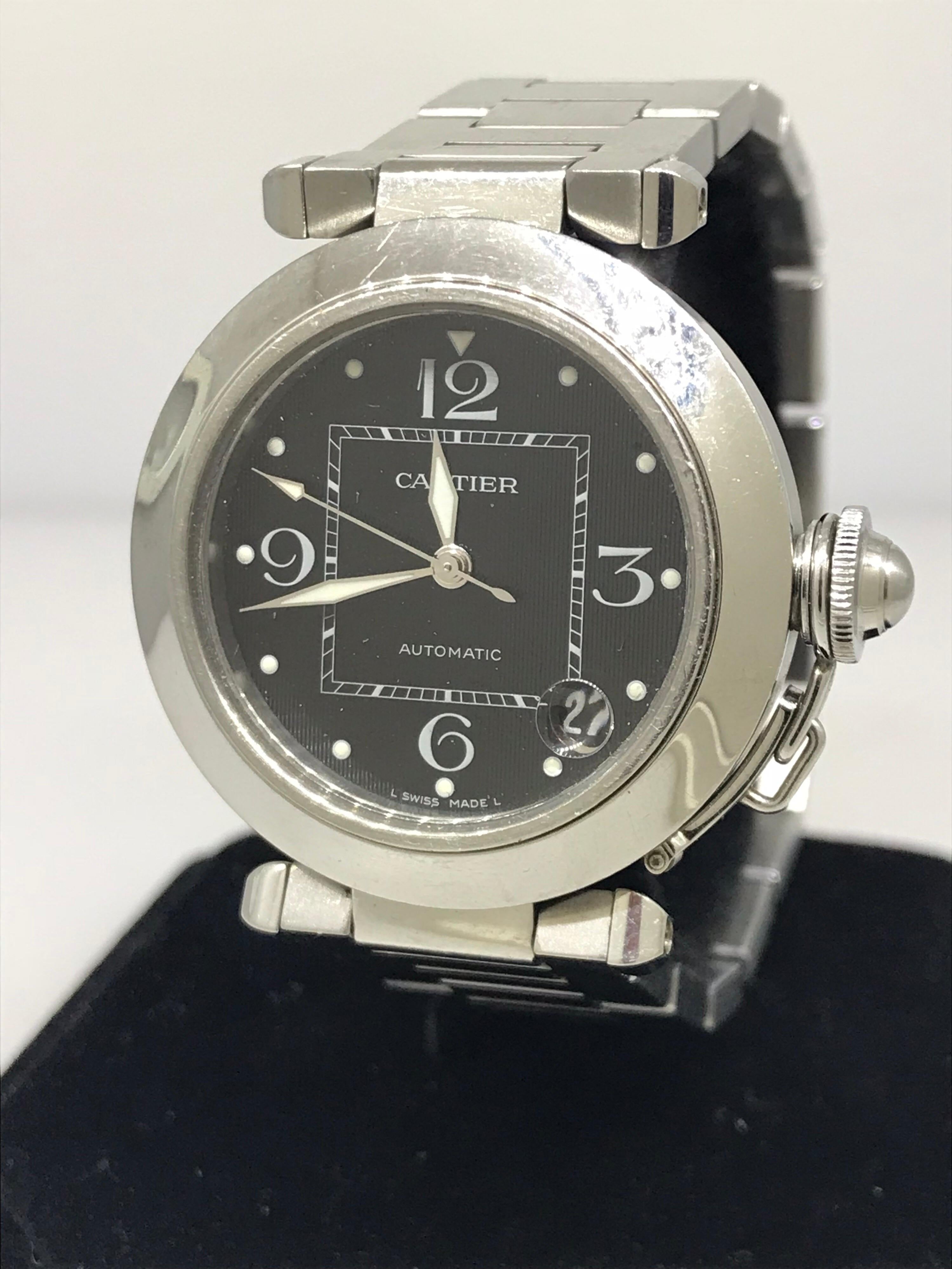 Cartier Pasha C Medium Men's Watch

Model Number: W31053M7

100% Authentic

Pre owned in Very Good condition

Comes with a generic watch box

Stainless Steel Case and Bracelet

Black Dial

Case Diameter: 35mm

Swiss made automatic movement

Display