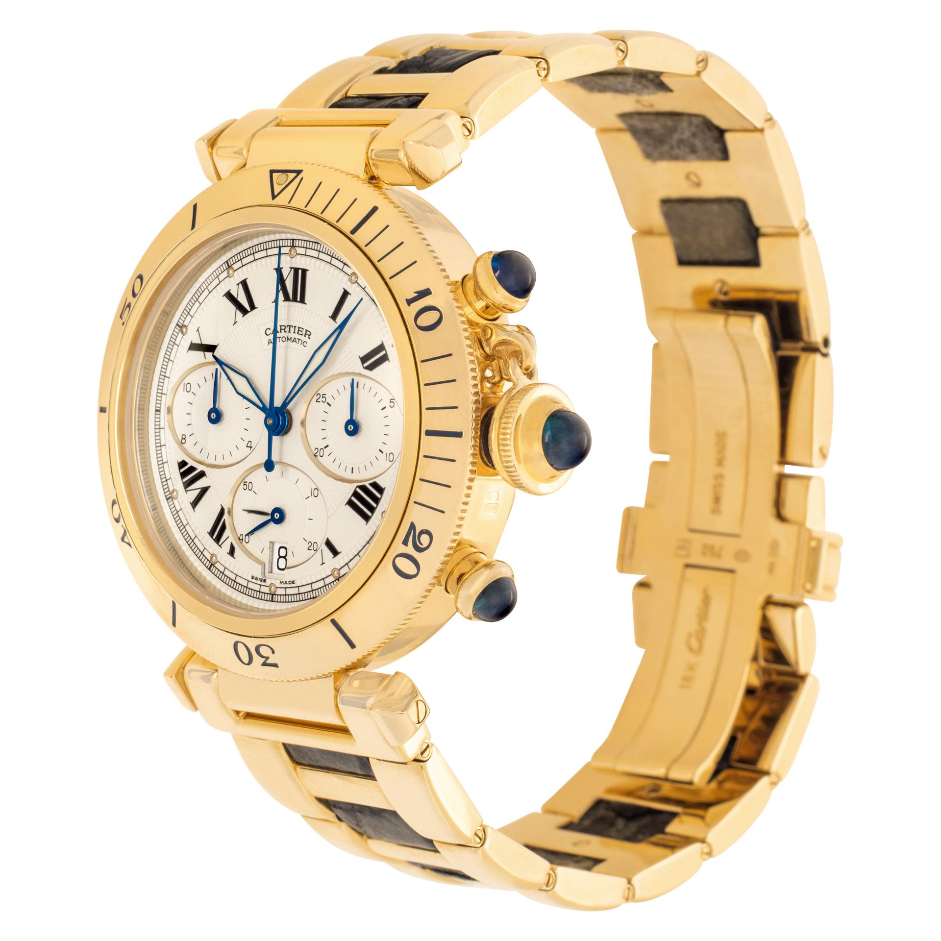 Cartier Pasha Chronograph in 18k yellow gold. Auto w/ subseconds, date and chronograph.37 jewels. Ref 2111. With 3 cabochon sapphires (on the crown & pusher). Bracelet made in 18k yellow gold and leather (leather showing slight signs of wear). Circa
