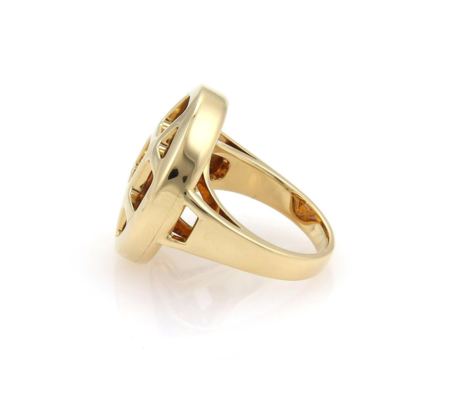 This is a lovely authentic ring by Cartier from the PASHA collection, it is crafted from 18k yellow gold in a fine polished finish. The round top has square sections, each with a color gemstone consisting of: amethyst and yellow citrine. It is fully