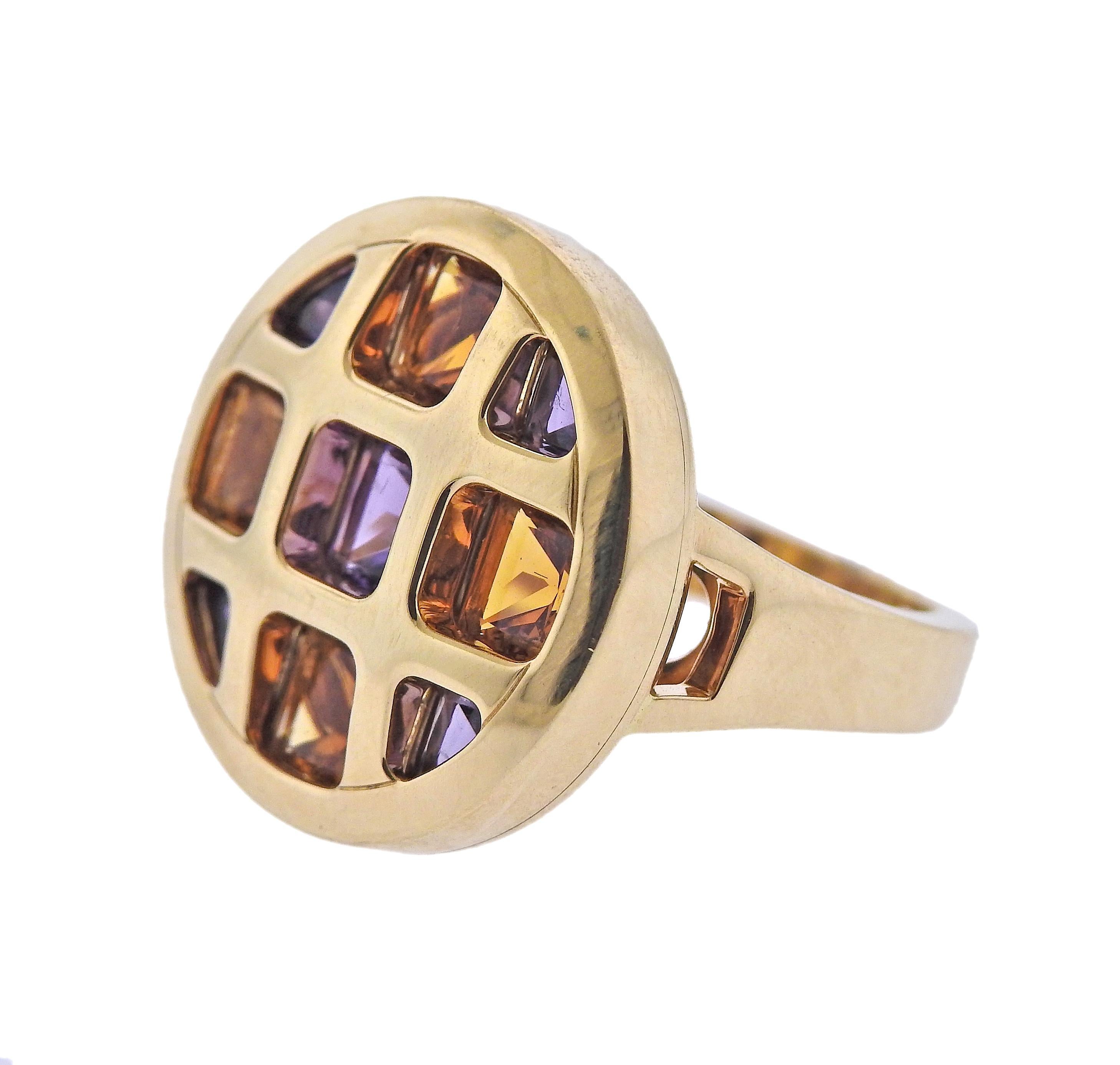 18k yellow gold Cartier Pasha ring, with amethysts and citrines. Ring size - 5.5 (sizing balls ca be removed to increase the size). Ring top is 20mm in diameter. Marked: Cartier, 750, NV4119, 54. Weight - 15.9 grams.