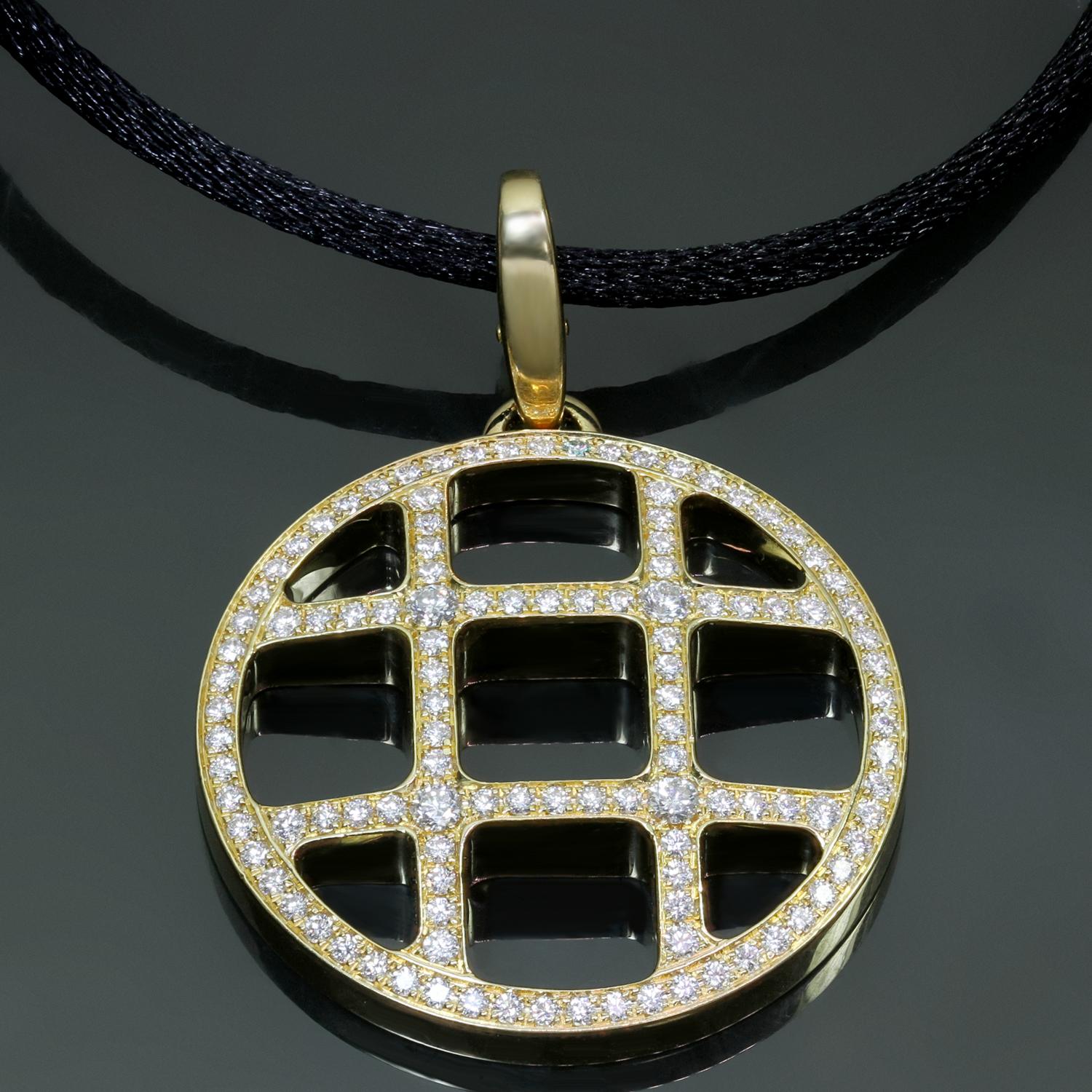 This gorgeous Pasha De Cartier openwork circle pendant enhancer is crafted in 18k yellow gold, pave-set with brilliant-cut round D-E-F VVS1-VVS2 diamonds and completed with an adjustable black silk cord. Made in France circa 1990s. Measurements: