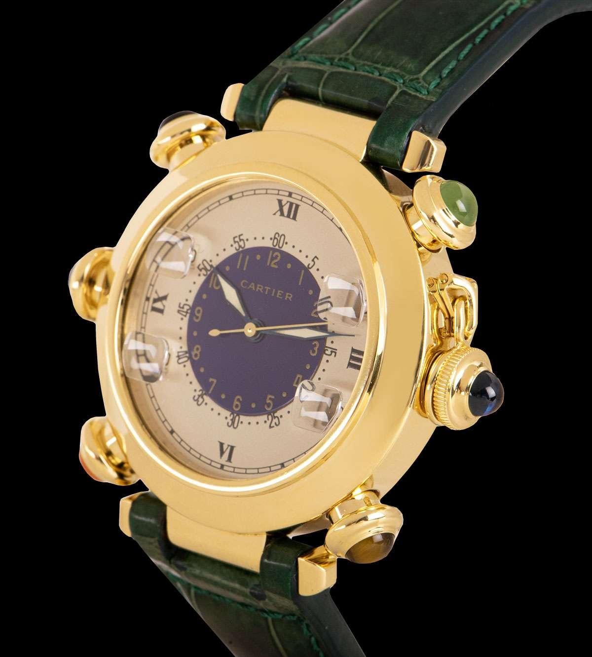 A 38 mm 18k Yellow Gold Pasha de Cartier Golf Gents Wristwatch, off white dial with roman numerals III, VI, IX and XII, blue centre with arabic numbers, four stroke/shot counters each at 2, 4, 8 and 10 0'clock controlled using the five push buttons,