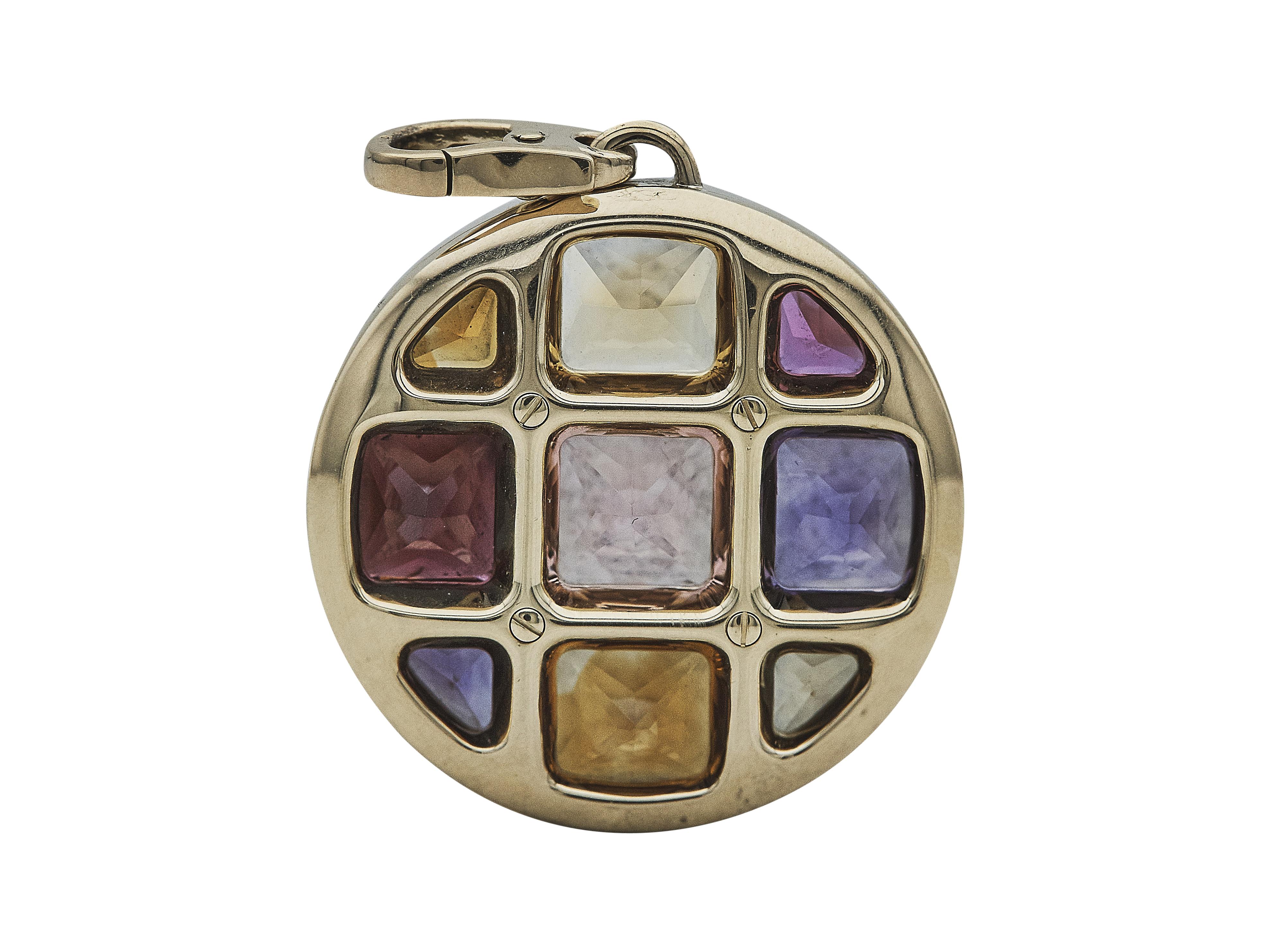 The pendant: A Cartier Pasha de Cartier pendant. Designed as citrine, amethyst, garnet and pink tourmaline in eighteen karat yellow gold.

The pendant is in excellent condition, with only a few minor scratches that are expected with normal wear. The