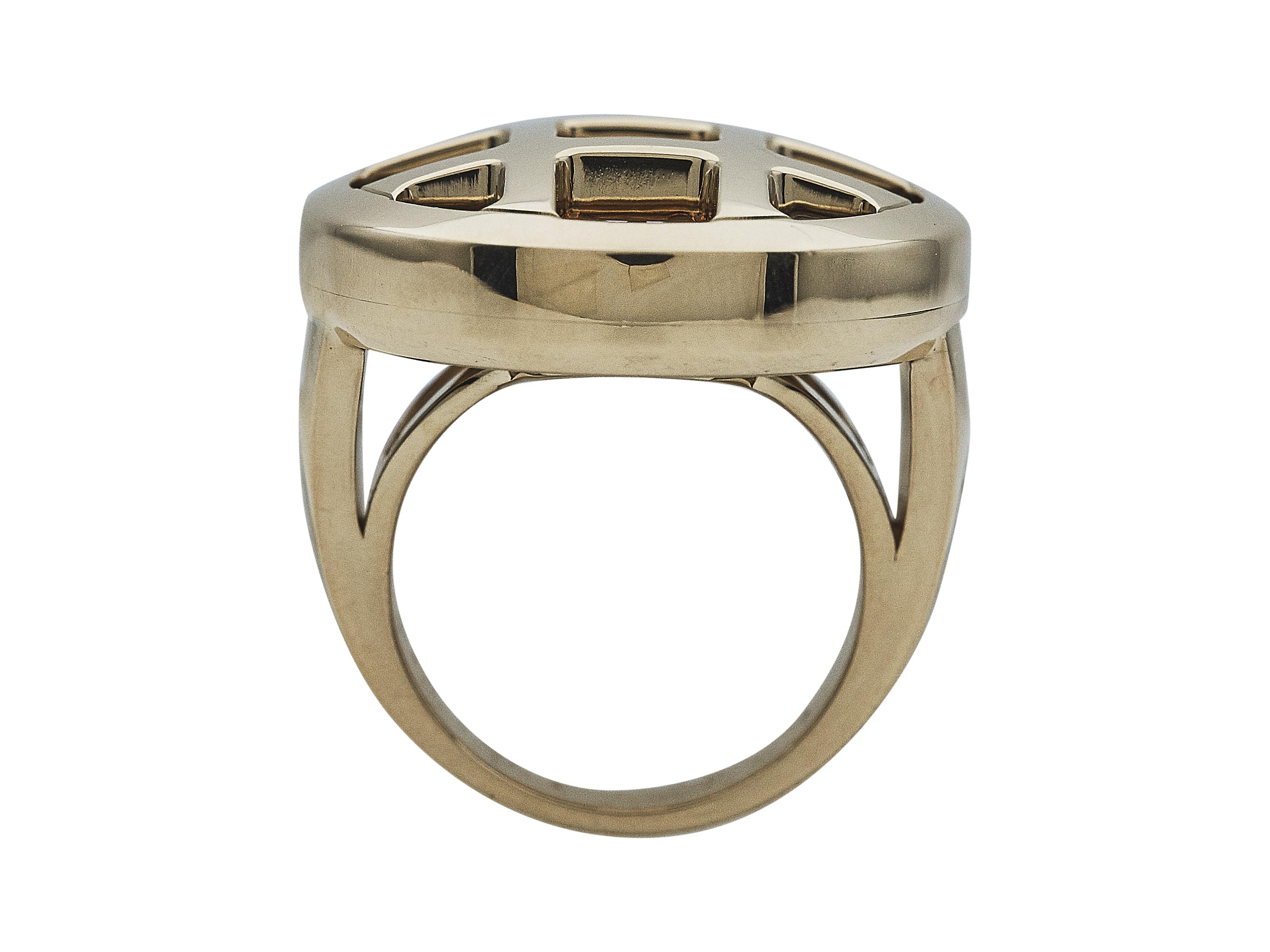 The ring: A Cartier Pasha de Cartier ring. Designed as citrine, amethyst, garnet and pink tourmaline set in eighteen karat yellow gold.

The ring is in excellent condition, with only a few minor scratches that are expected with normal wear. The