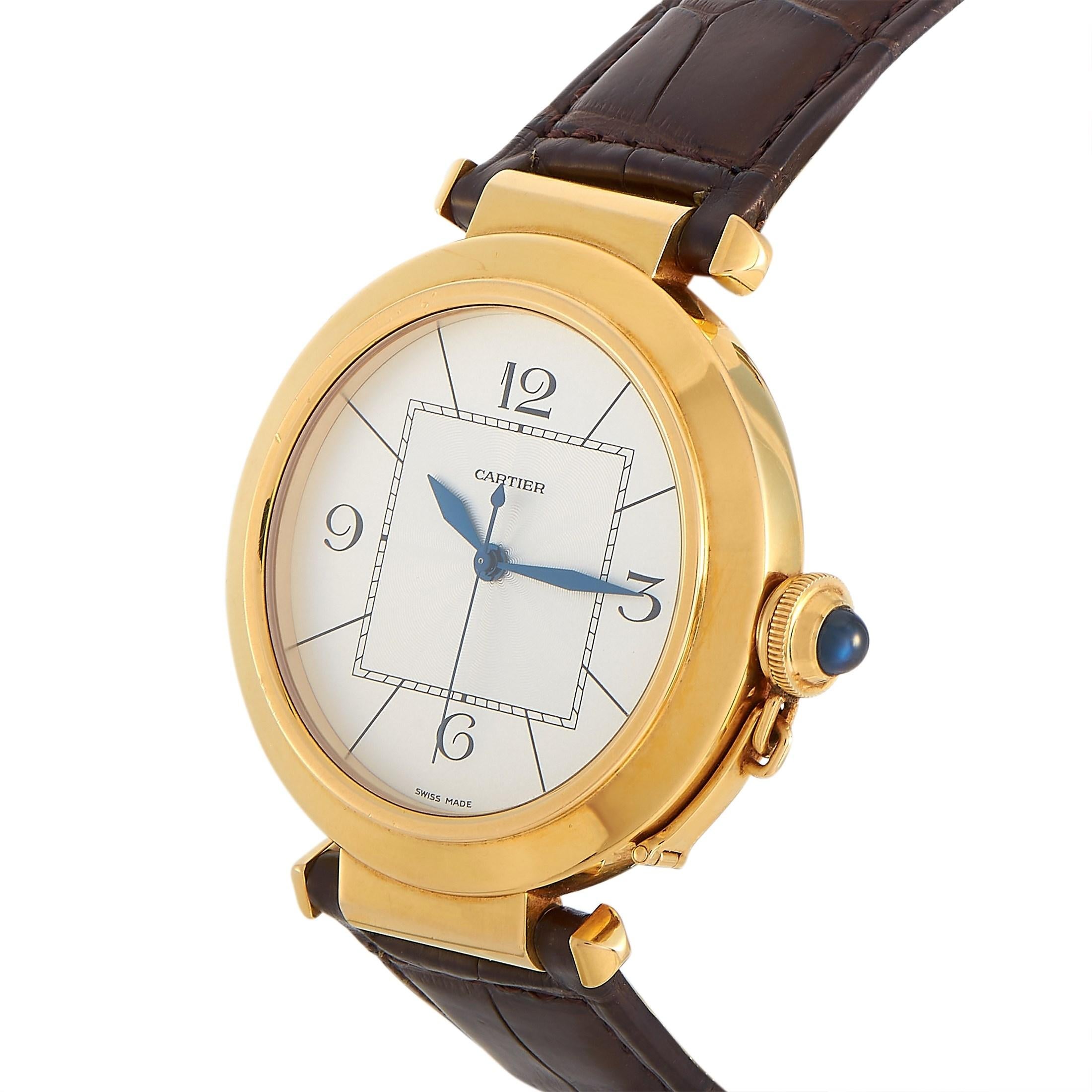 The Cartier Pasha 42 mm Watch, reference number W3018651, is a part of the Pasha De Cartier collection. The watch comes with an 18K Yellow Gold case measuring 42 mm in diameter and is presented on a Brown Leather Band with a deployment Clasp. This