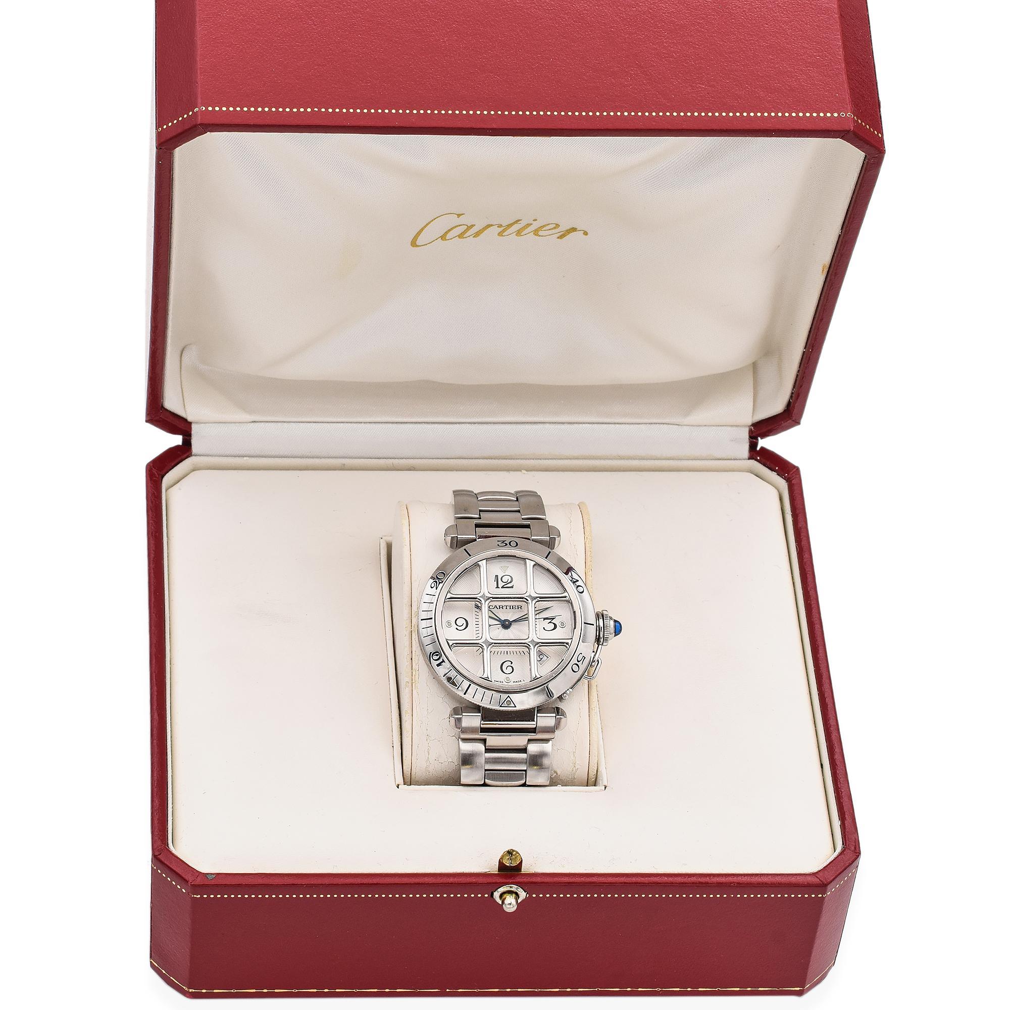 Pasha de Cartier watch, 38 mm, chronograph mechanical movement with automatic winding. Steel case, fluted crown cap and crown set with synthetic spinel, diamond-shaped hands, steel bracelet. 

Weight: 114.9 Grams 
Case Diameter: 38 mm (thickness: