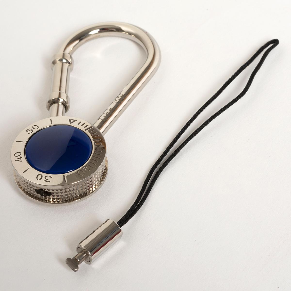 Our very rare stainless steel and blue colour Cartier Pasha keyring is presented in superb condition, and 22.8mm across, 10mm deep, the keyring loop taking the total length to 62mm. Coming complete with its fitted Cartier box and secondary loop