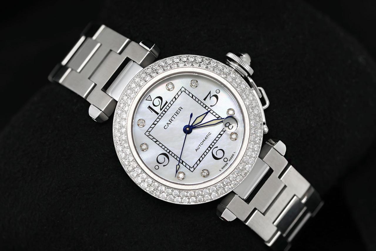 Cartier Pasha Ladies Watch with White Mother of Pearl Diamond Dial Two Row Diamond Bezel #2324

Cartier Pasha is a automatic stainless steel watch. 35mm stainless steel case, custom 2 row diamond bezel, custom diamond dial. Watch has been fully
