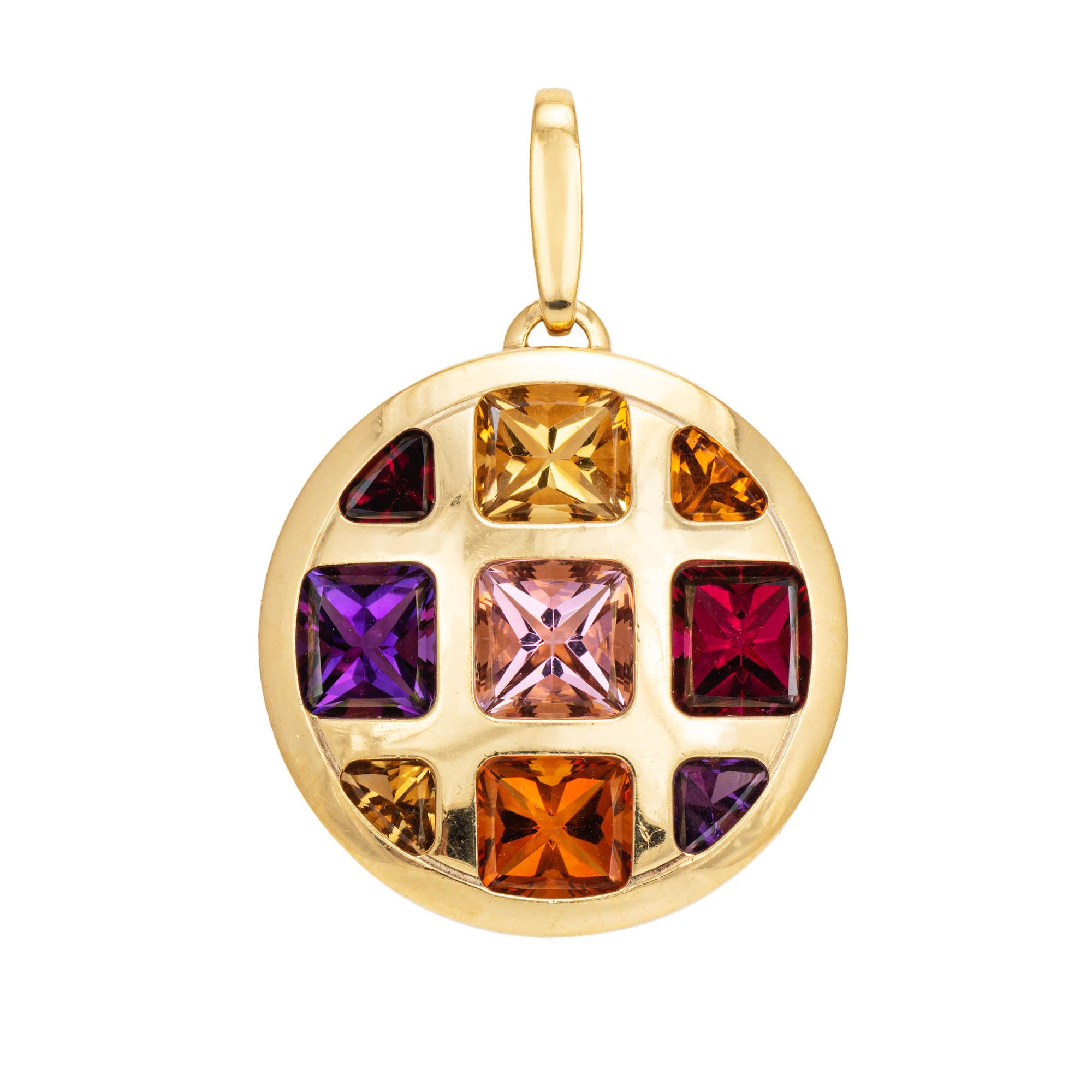 Stylish pre-owned Cartier 'Pasha' multi gemstone pendant crafted in 18k yellow gold.  

The pendant is set with amethyst, citrine, and pink tourmaline. The semi-precious gemstones are in very good condition and free of cracks or chips.

While the