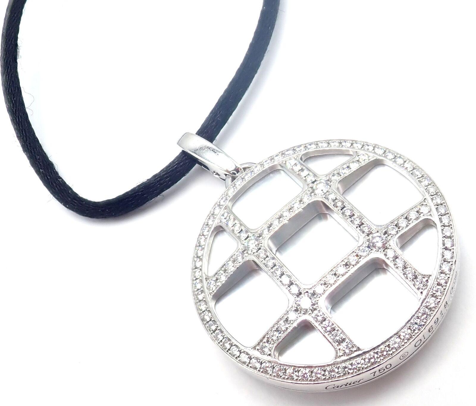 18k White Gold Pasha De Cartier Diamond And Mother Of Pearl Pendant on a Silk Cord Necklace by Cartier. 
With Round brilliant cut diamonds, VS1 clarity, G color. Total weight: 2.20ct. 
This beautiful necklace comes with Cartier box. 
Details:
