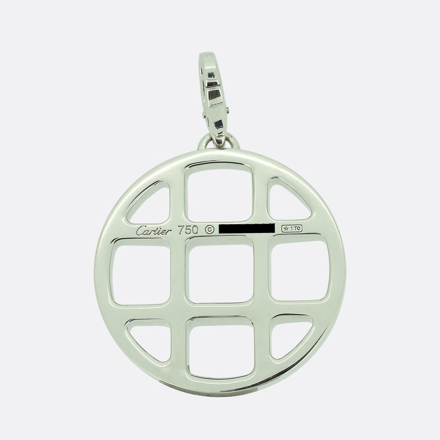 Here we have a sleek and stylish pendant from the world renowned luxury jewellery house of Cartier. This pendant has been crafted from 18ct white gold into a circular shape with an open criss cross design at the centre; complete with a high polish