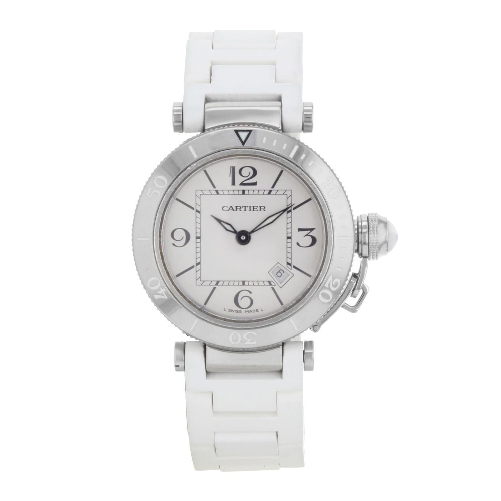 This pre-owned Cartier Pasha W3140002 is a beautiful Womens timepiece that is powered by a quartz movement which is cased in a stainless steel case. It has a round shape face, date dial and has hand arabic numerals, sticks style markers. It is