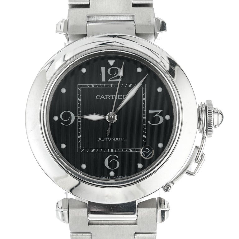 Men's steel Cartier Pasha automatic date with black dial. Recently serviced. 8 inch band. 

Length: 8 Inches- can be shortened 
114.2 grams 
Length: 42mm
Width: 36mm
Band width at case: 18mm
Case thickness: 9.45mm
Band: stainless steel 
Crystal: