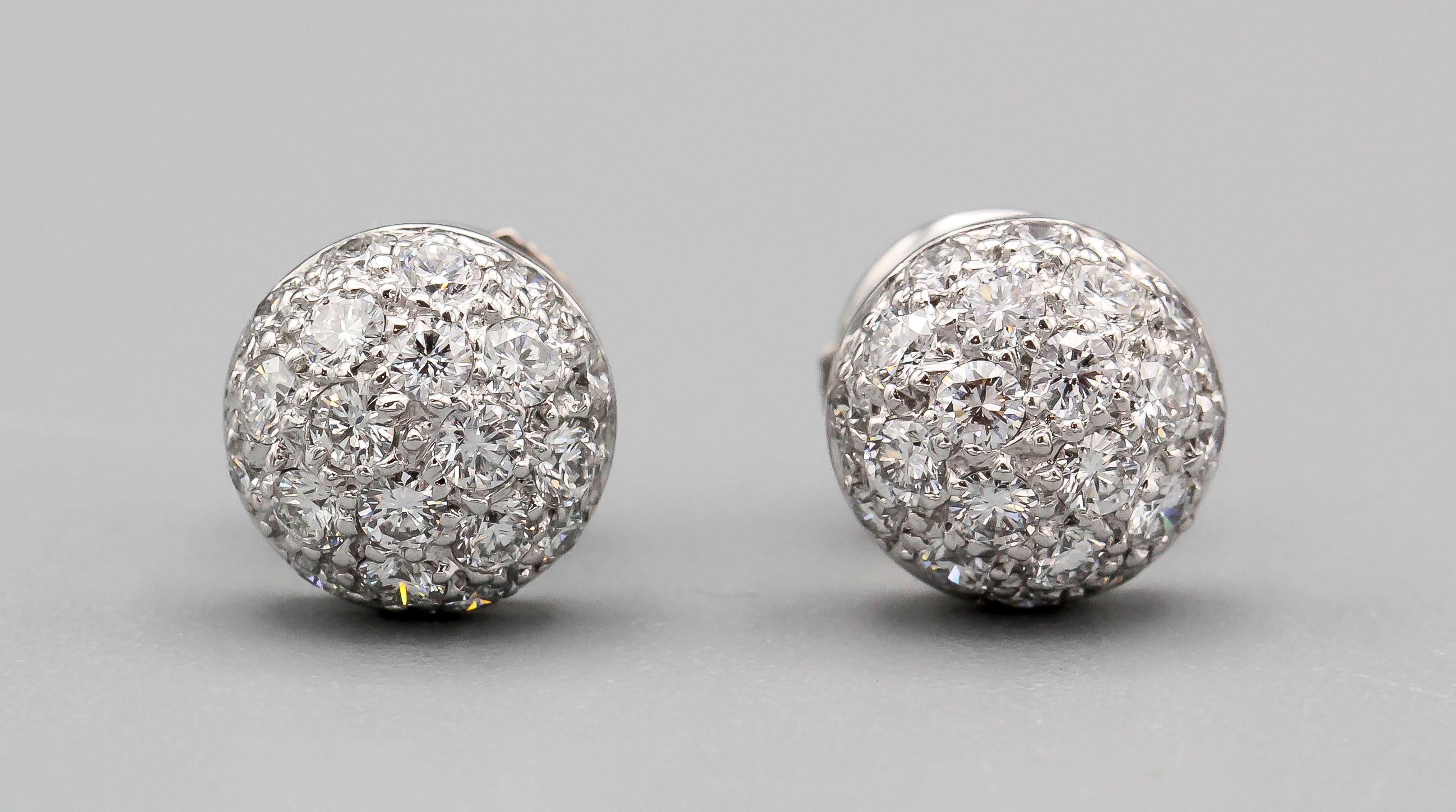 Fine pair of pave diamond and 18k white gold dome earrings by Cartier.  Designed as a stud earring, they are easy to wear day or night, business or casual attire.

Hallmarks: Cartier 750, reference numbers.