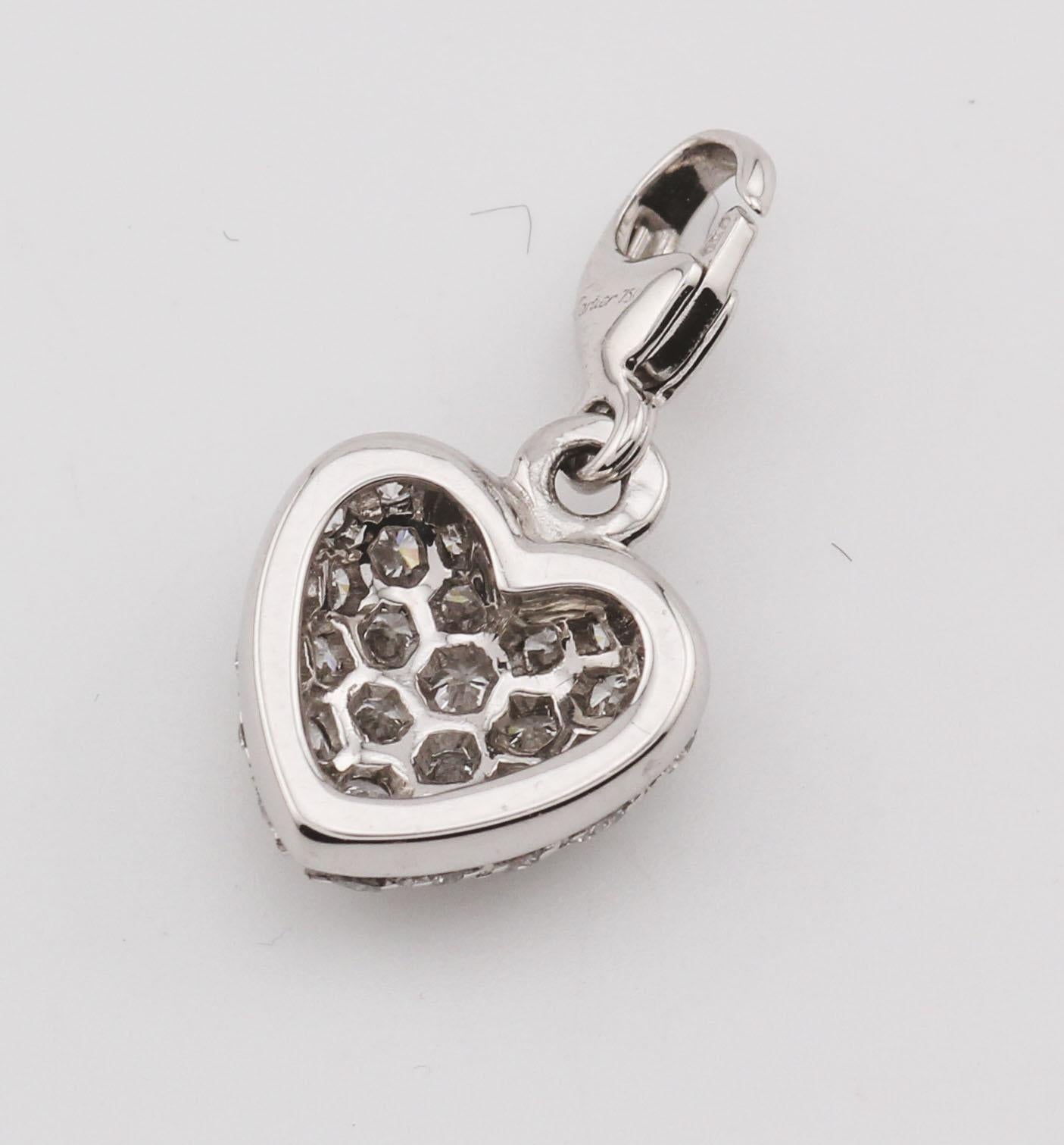 Embodying the essence of love and timeless luxury, the Cartier Pavé Diamond 18K White Gold Heart-Shaped Pendant Charm is a dazzling expression of Cartier’s unmatched craftsmanship. Crafted from 18K white gold, this elegant charm is adorned with
