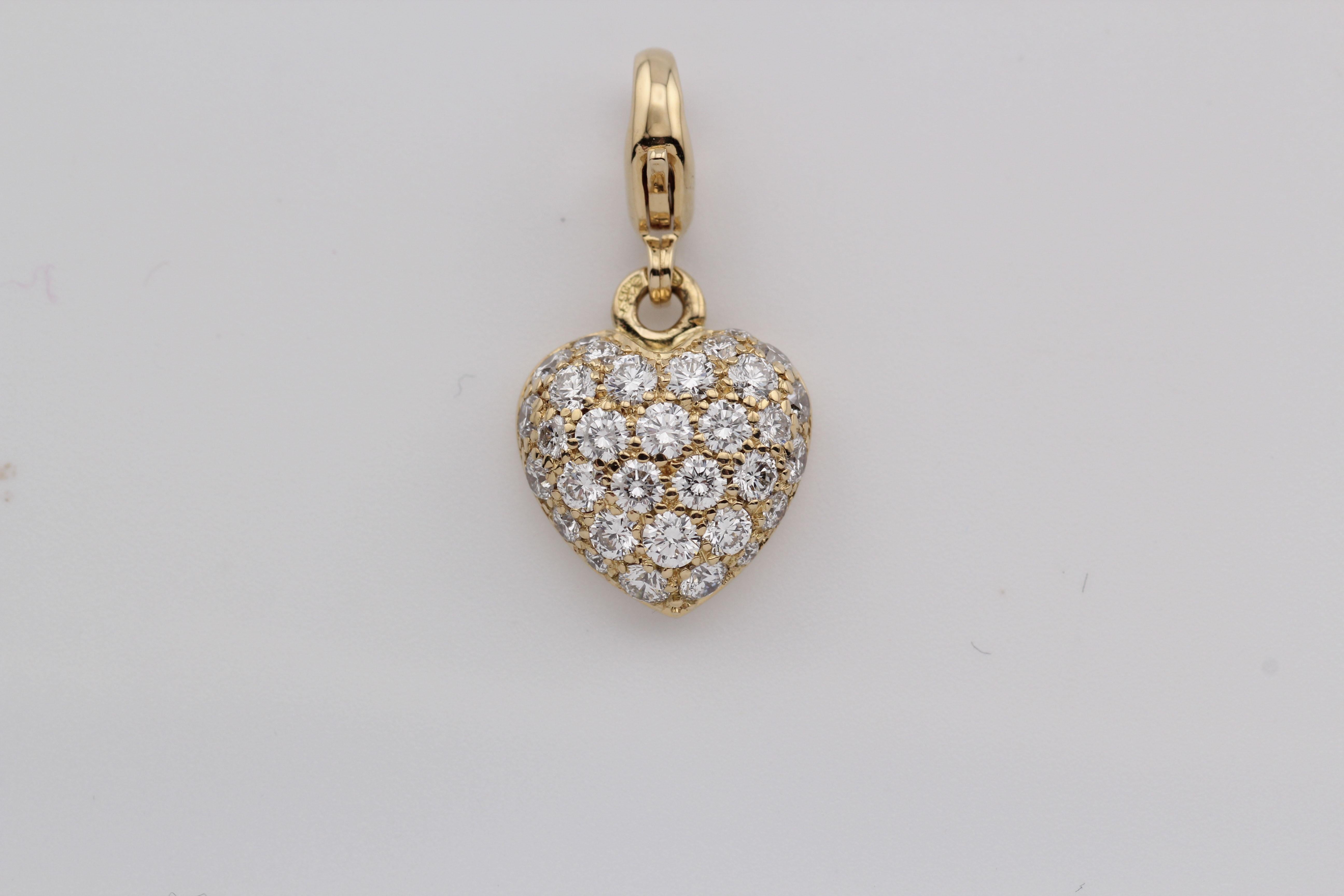 The Cartier Pavé Diamond 18K Yellow Gold Heart Pendant Charm is a breathtaking expression of love and elegance, crafted with Cartier’s signature refinement. 

Made from radiant 18K yellow gold, this exquisite charm is shaped into a classic heart