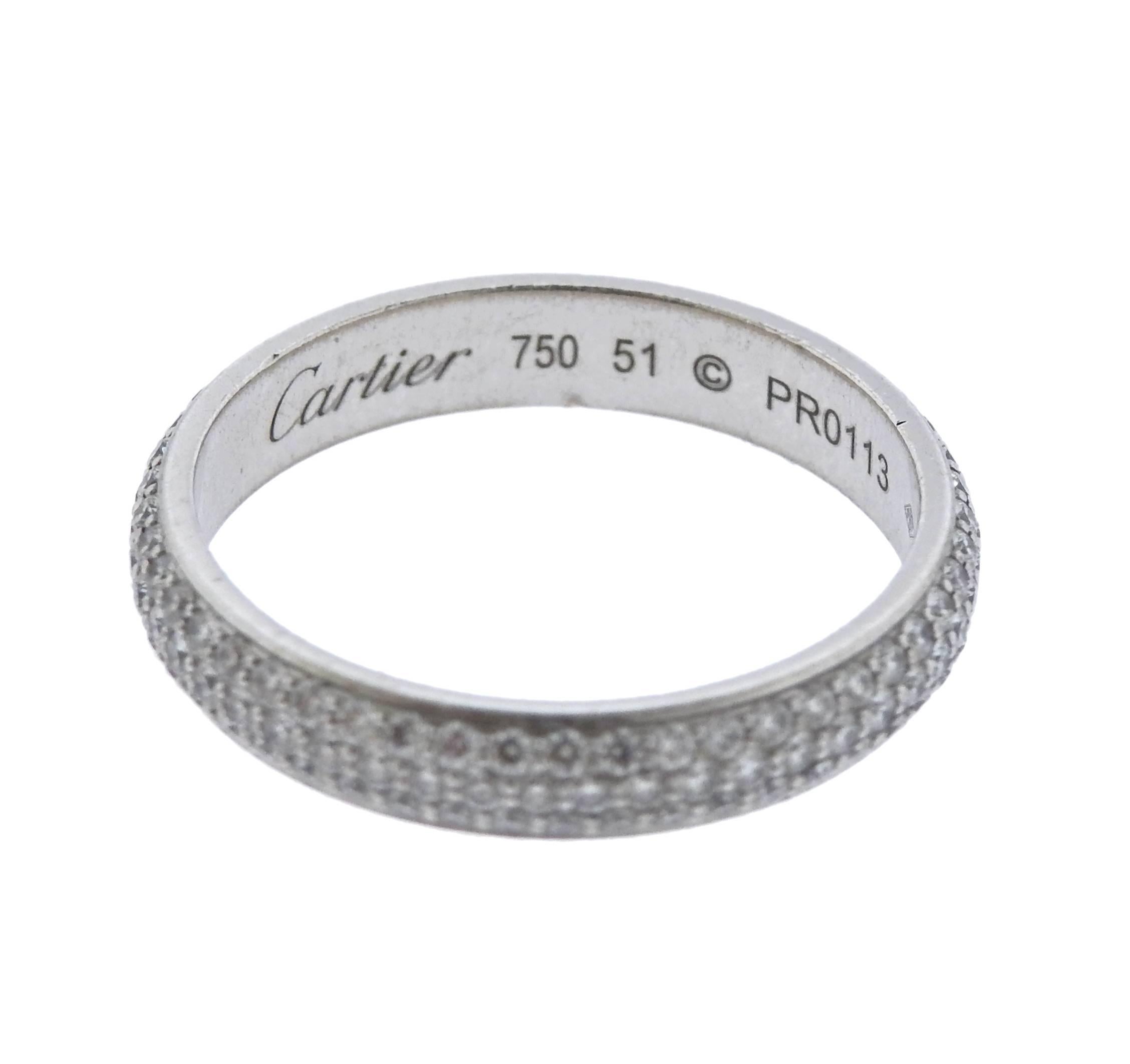 18k white gold eternity wedding band crafted by Cartier. Features approximately 1.10ctw of G/VS diamonds. Ring size 9, ring is 4mm wide. Cartier, 750, 51, PR0113, weight is 4.6 grams. Comes with box.