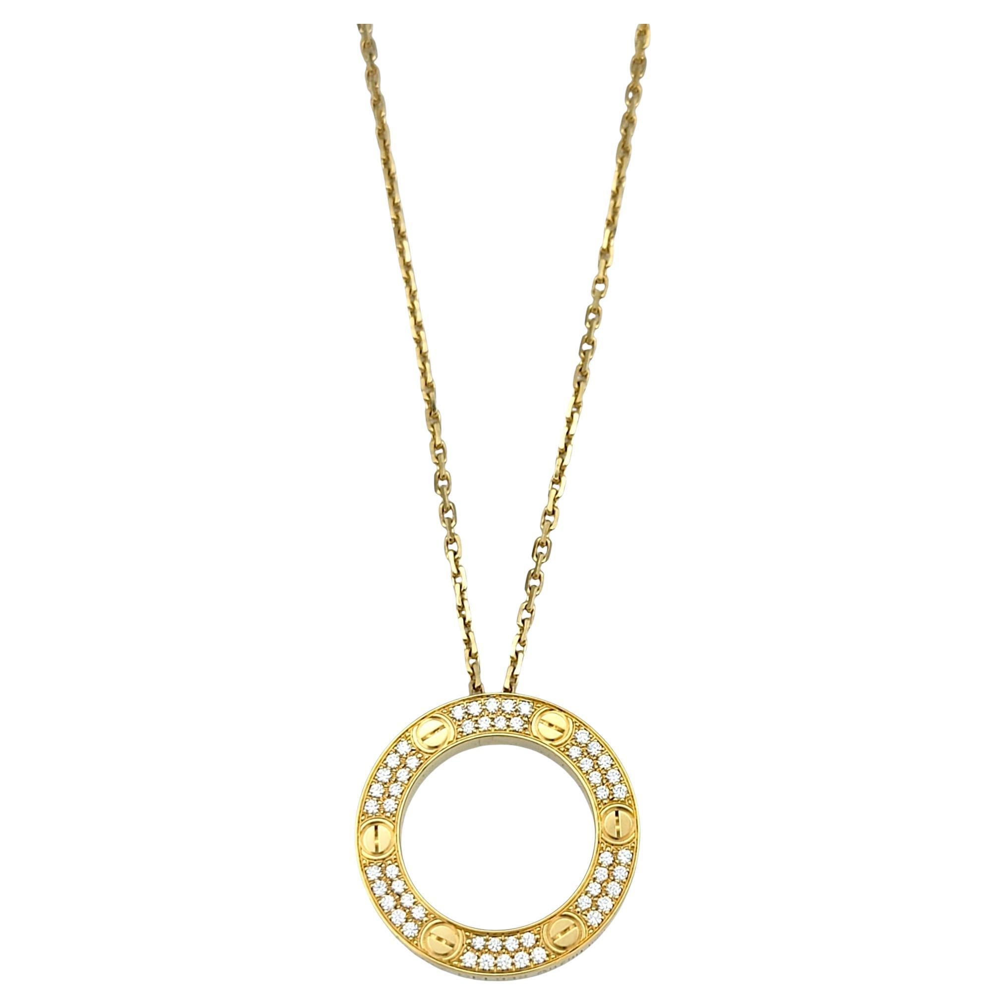 Elevate your style with the Cartier Love Necklace, a stunning interpretation of the maison’s most iconic design. This elegant piece features an open circle pendant, symbolizing eternity, with two distinct yet harmonious halves. One side shimmers